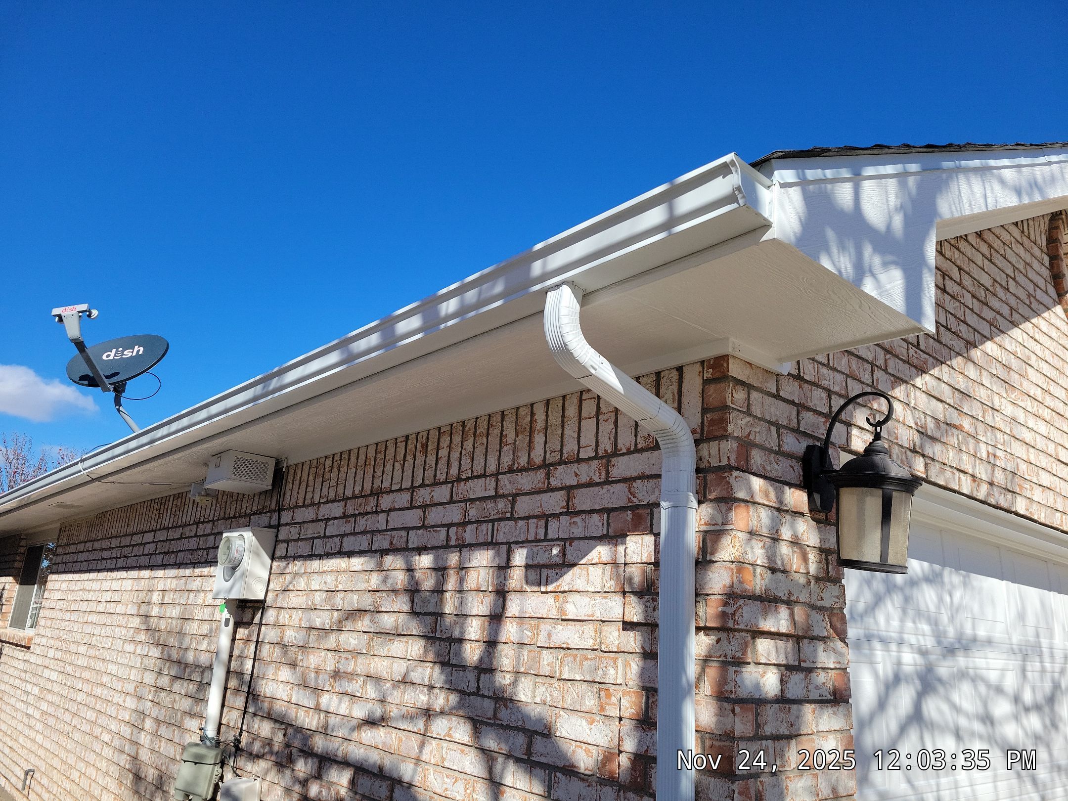 Seamless White Gutter and Downspout Installation in Albuquerque by Doyle Roof Masters Inc