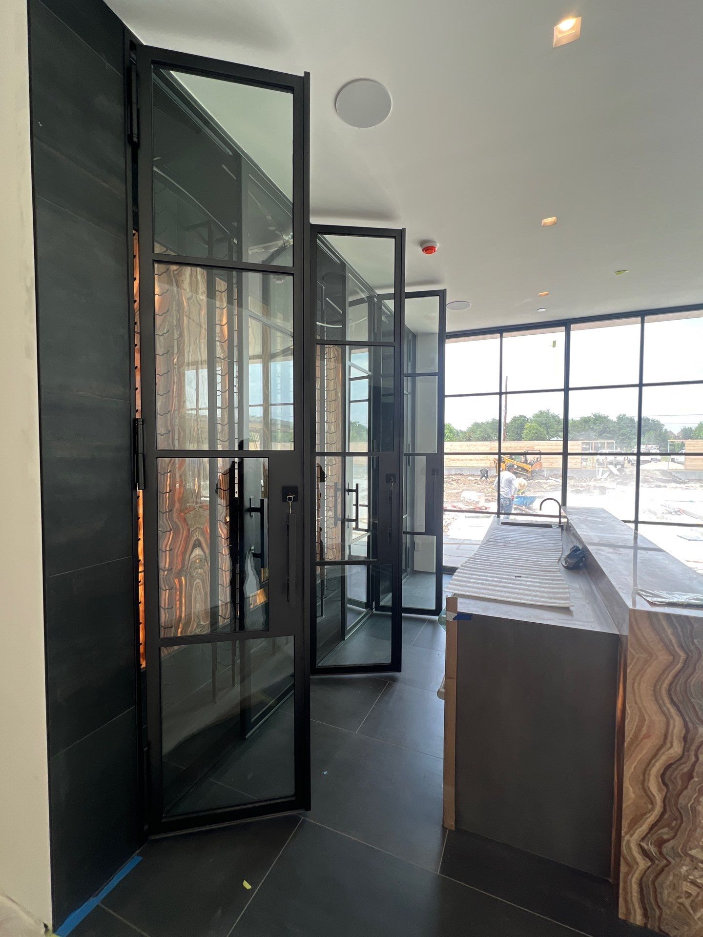 Custom Black-Framed Glass Wine Cellar Installation in Dallas by Solara Custom Living