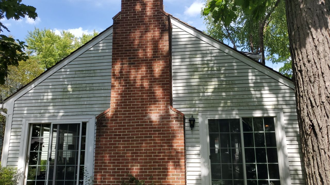 Housewashing  using Algaecide, soft wash soap by Northern Power Washing LLC.