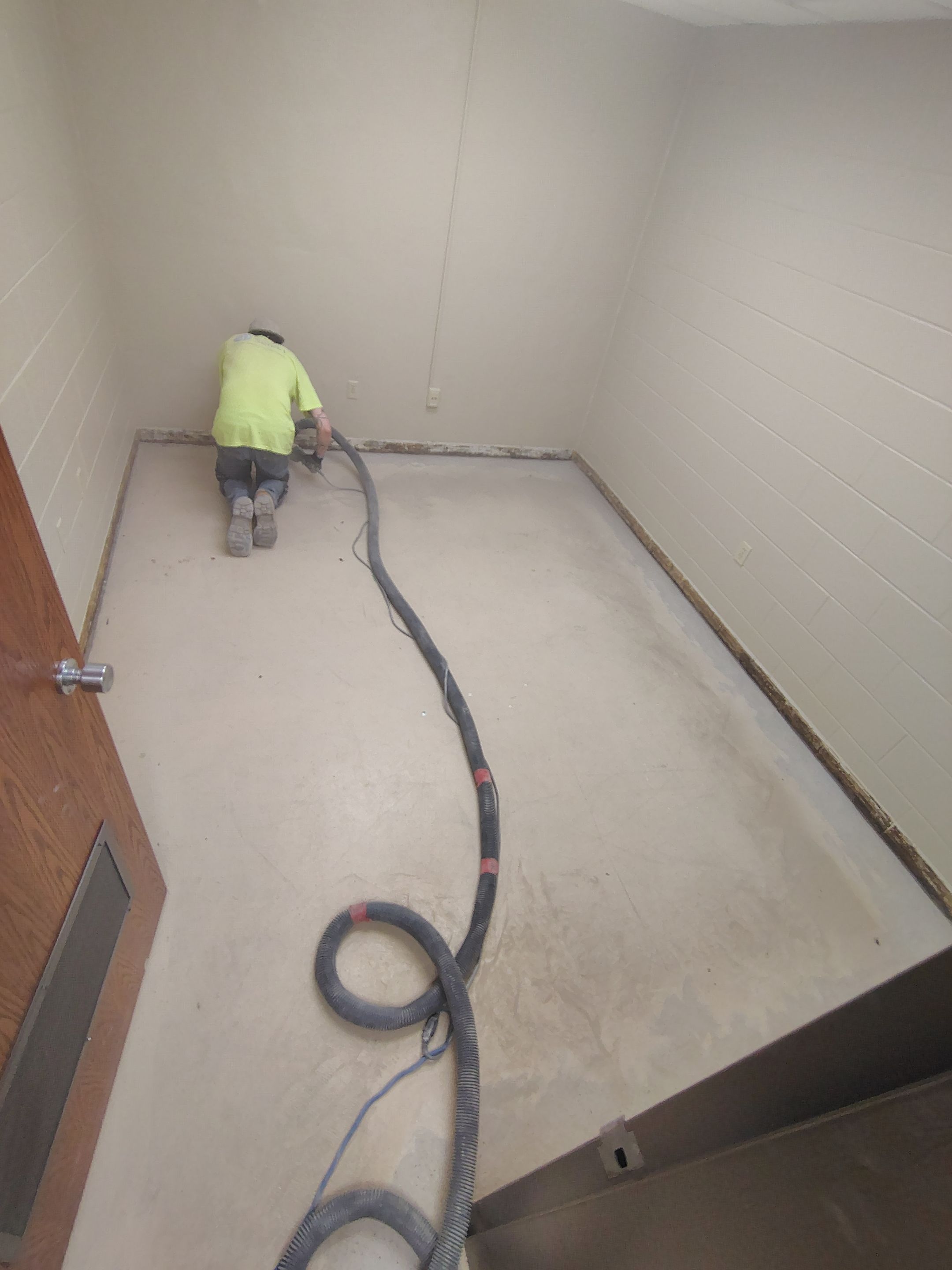 Industrial Flake Epoxy Floor Installation at Pierre National Guard Facility by Select Painting, Coatings & Garage Cabinets