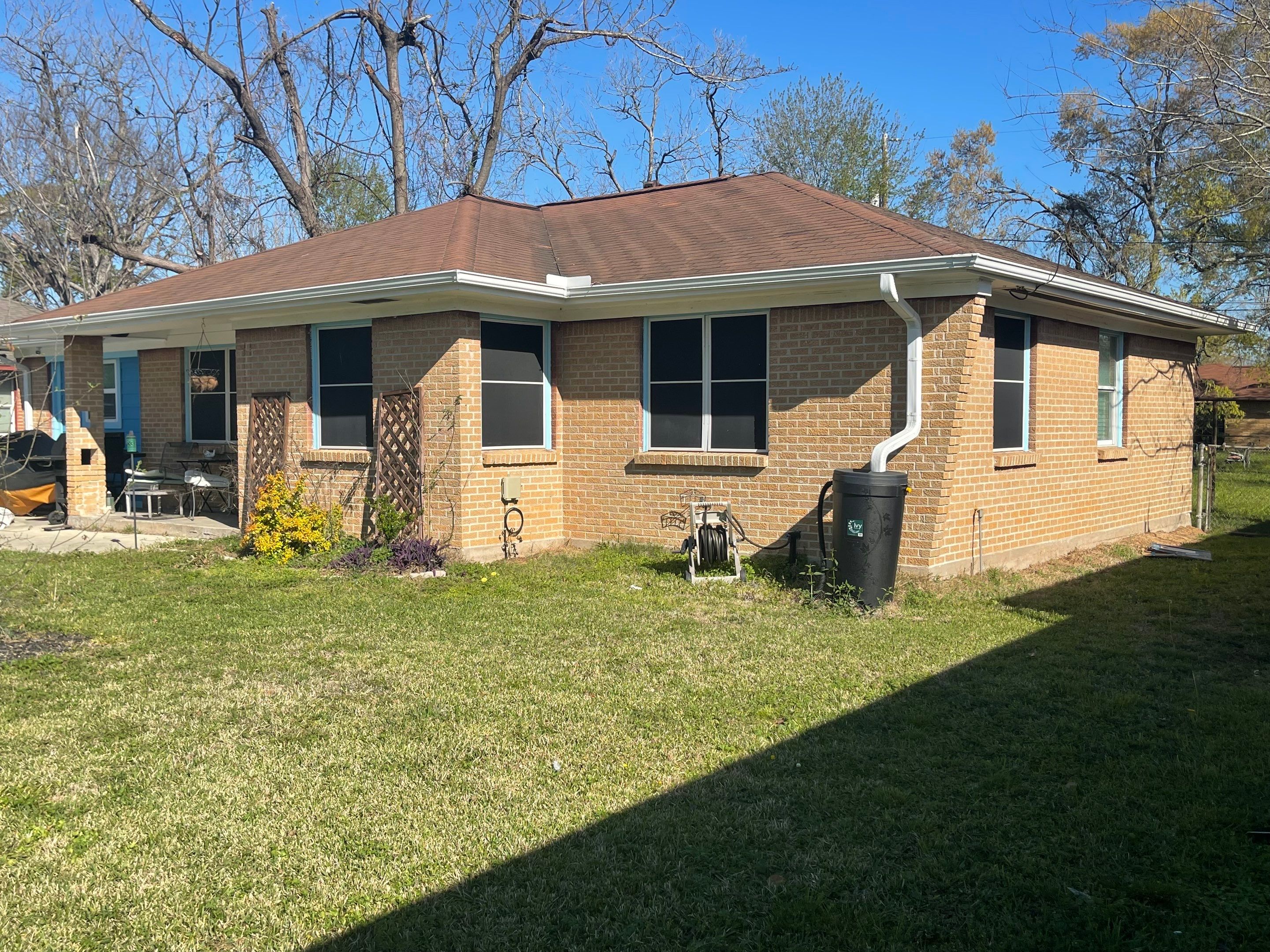Houston Residential Roof Replacement Using Harbor Blue Architectural Shingles by Houston Roofing & Construction