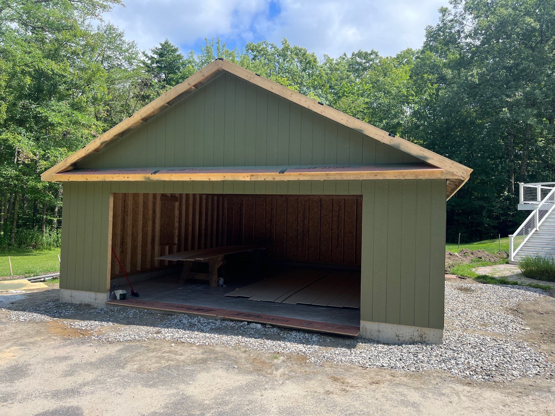 Two-Car Garage using LP SmartSide Panel Siding by Chagnon Building & Remodeling LLC