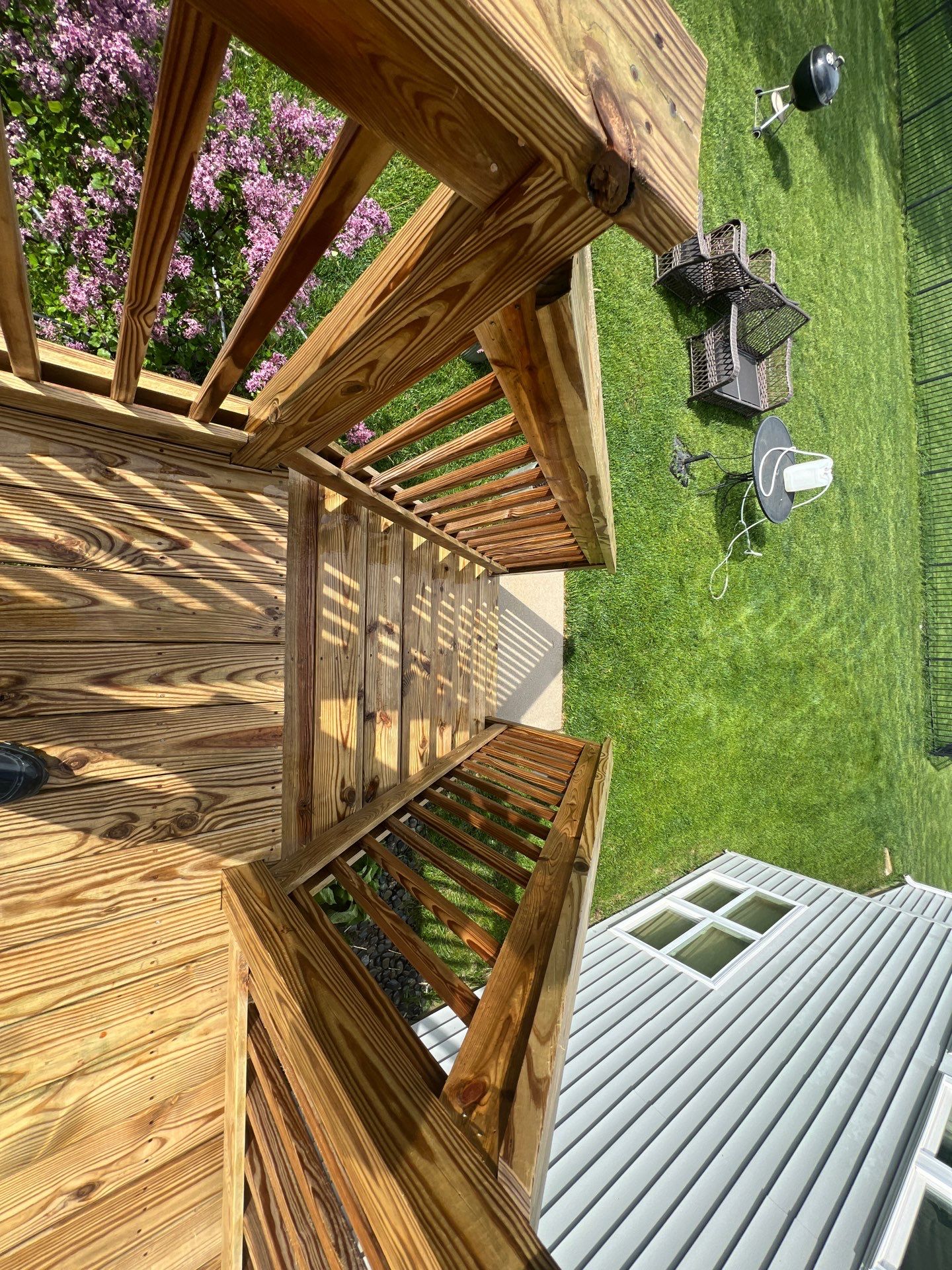 wood deck cleaning and staining by Northern Power Washing LLC.