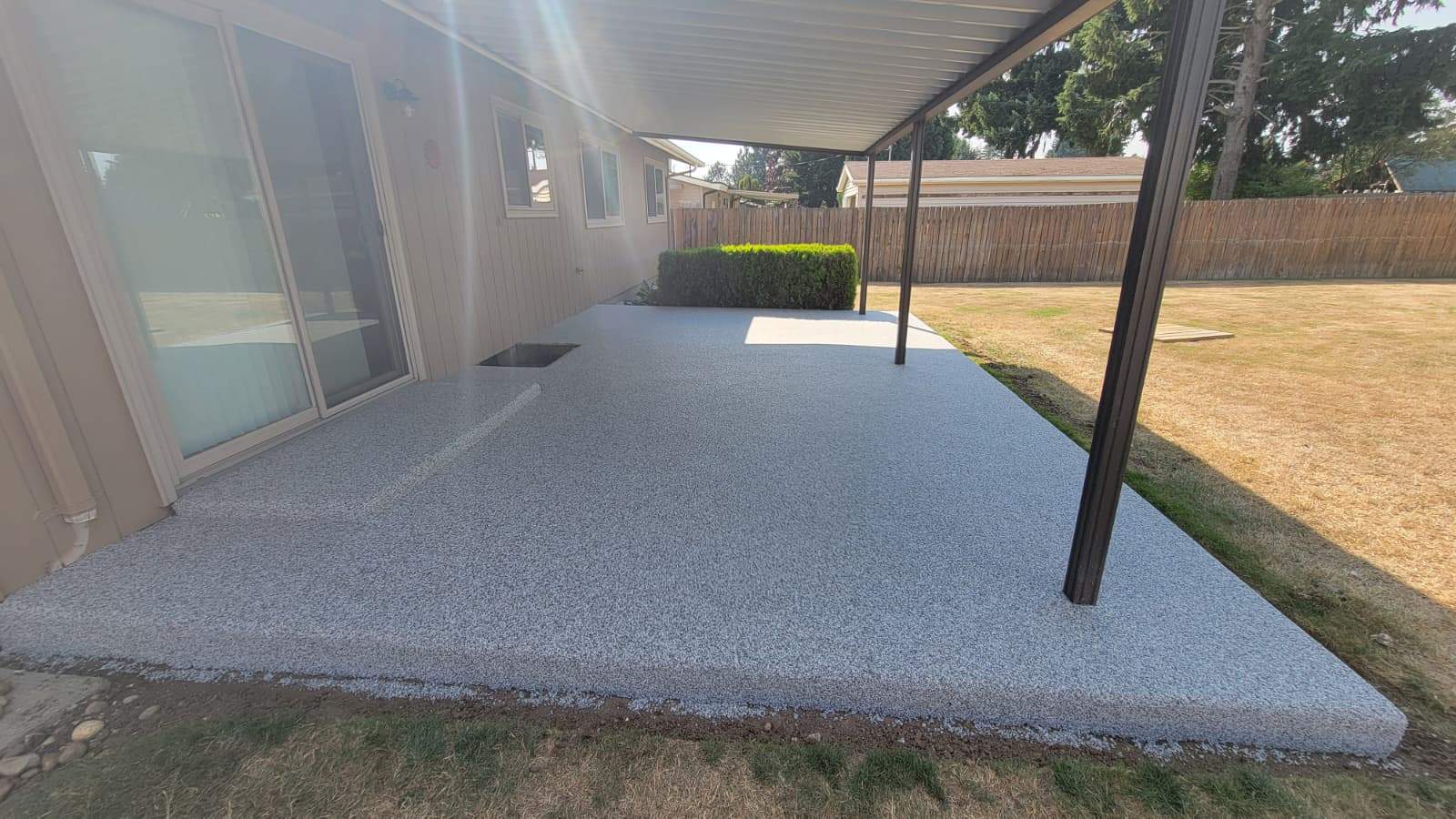 Coastal Elegance Patio in PoseidonVuba Stone by Concrete Coating Experts Inc.