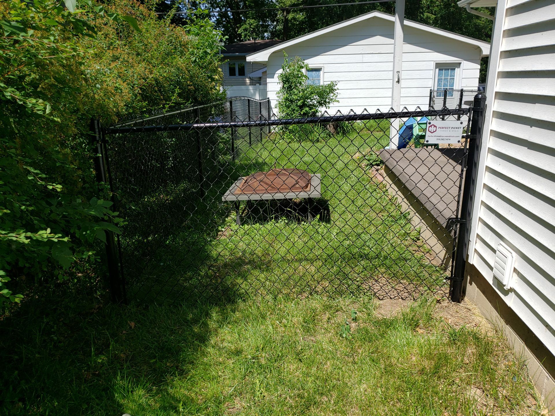 Black Chain Link Perimeter Fence and Gate Installation in Cedar Falls by Perfect Picket Fence and Stain