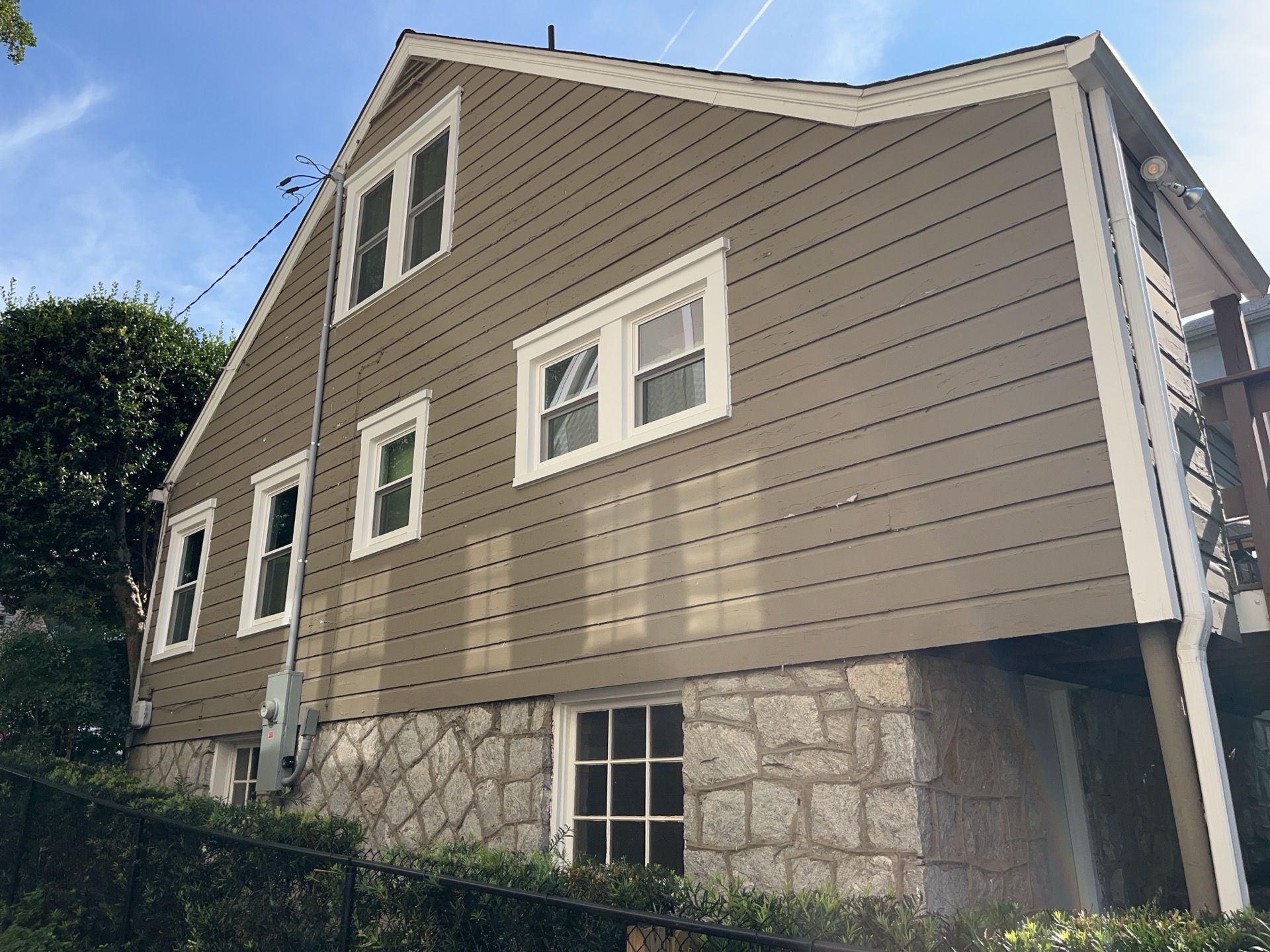 Full Siding Replacement, Deck Build, Exterior Paint, and Gutter Replacement  by Nelson Exteriors 