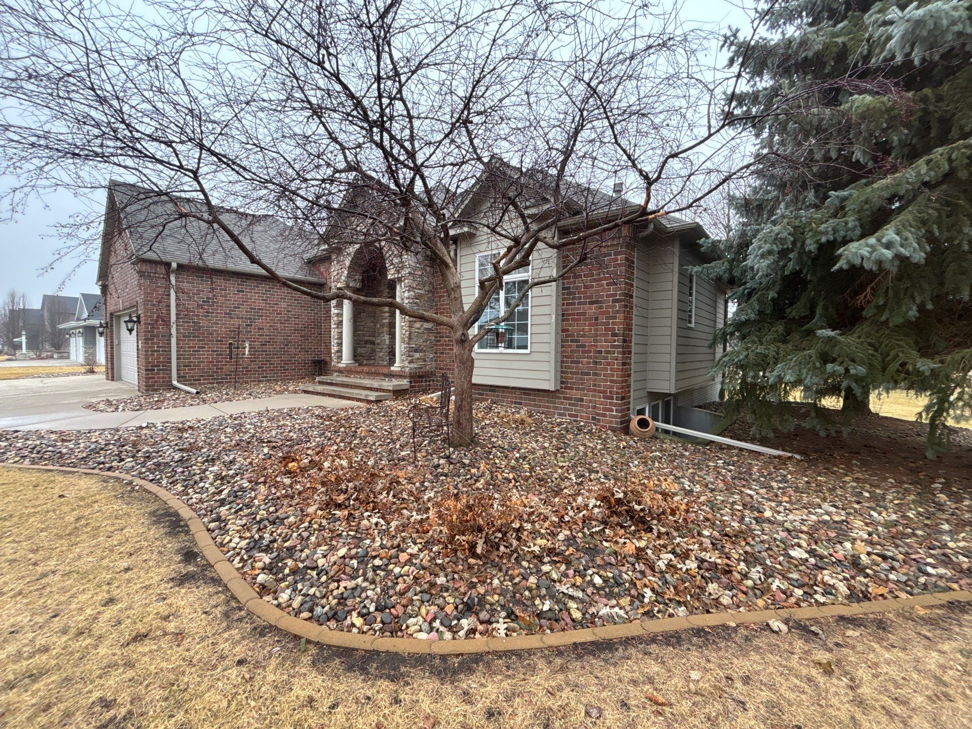 Sioux Falls Concrete Driveway Replacement and Custom Front Walkway by Select Painting, Coatings & Garage Cabinets