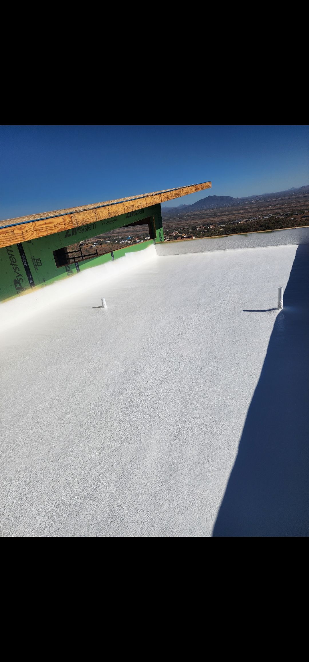 Dark Bronze Standing Seam by Reimagine Roofing
