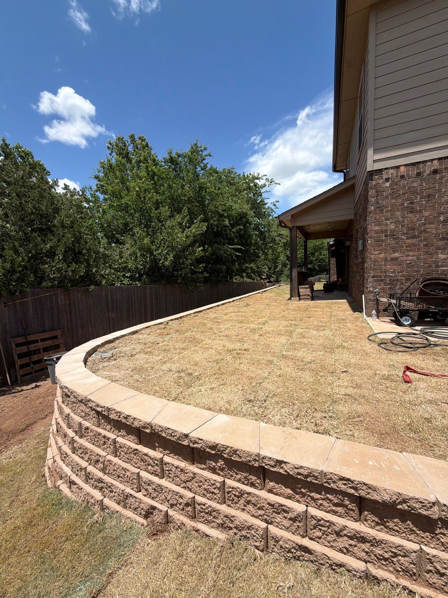 Custom Segmental Block Retaining Wall and Sod Installation in Lawton by Clays Services Inc