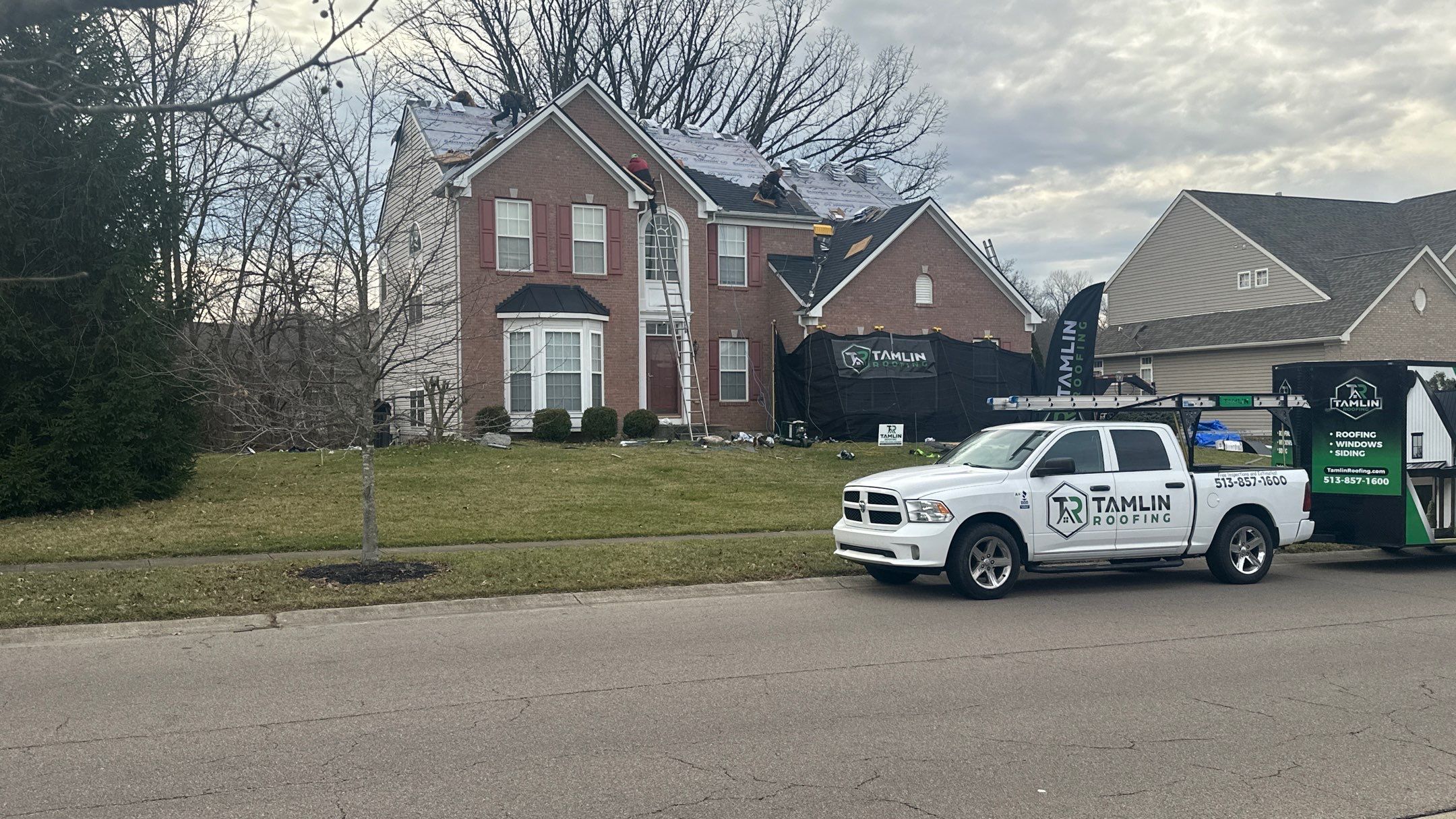 Walden Ponds - Pristine Black and Hydro Flo Gutter Guards by Tamlin Roofing