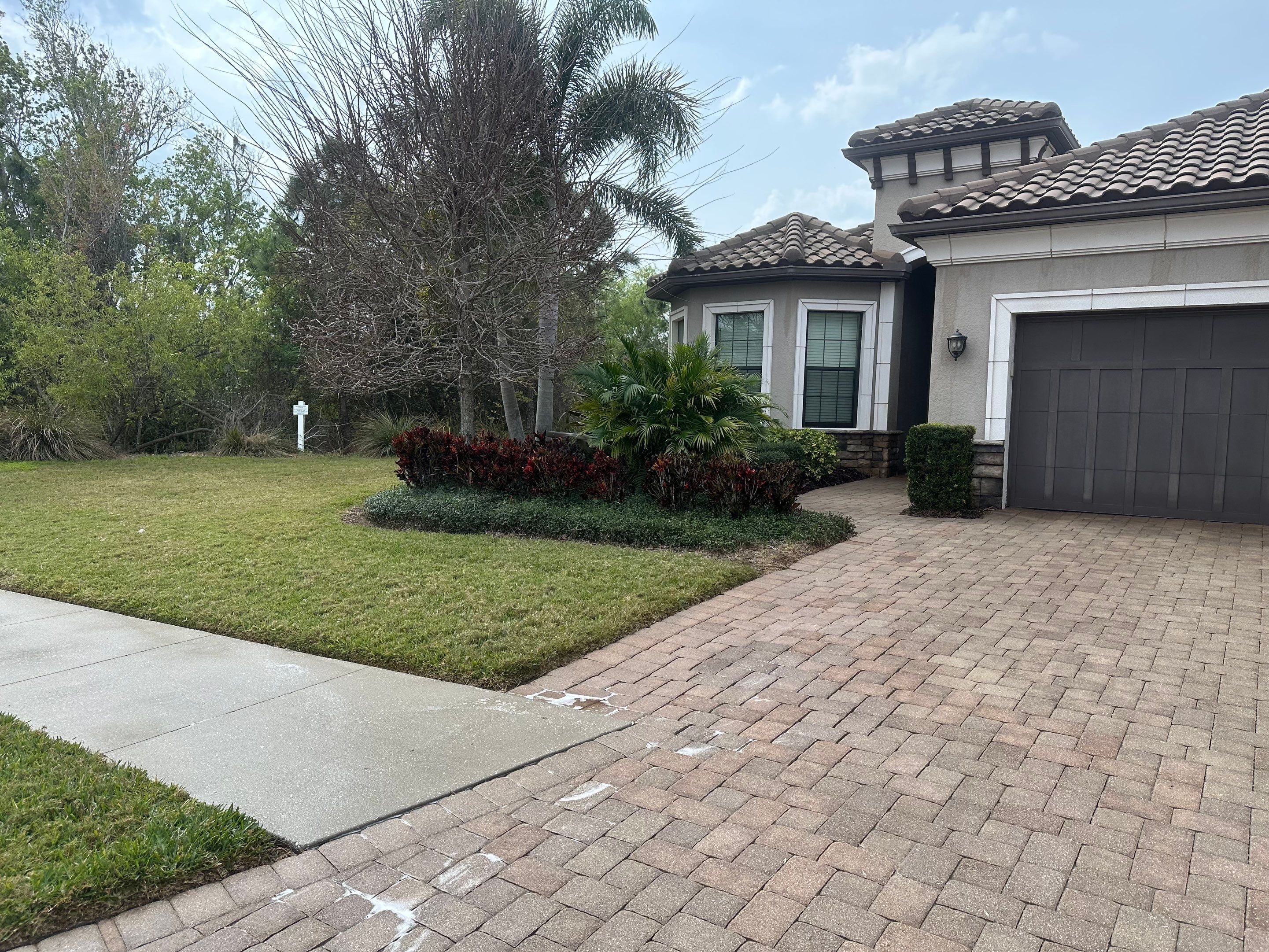 Concrete Tile Roof, Paver Pool Deck, Screen Enclosure & Driveway Cleaning in Artisan Lakes Esplanade, Palmetto, FL | Sunshine AquaWash by Sunshine AquaWash