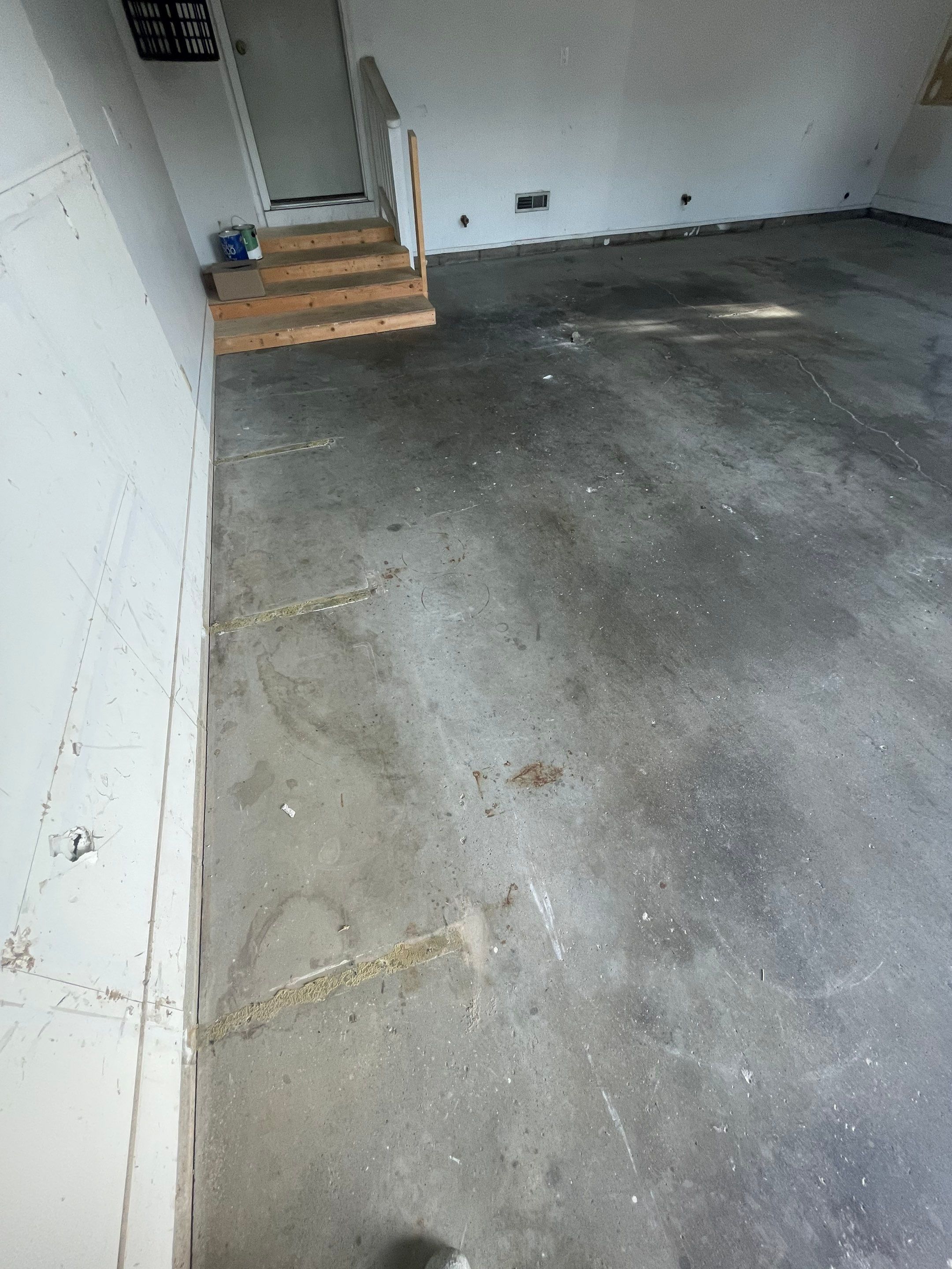 Grey Speckled Concrete Coating for Residential Garage in Yankton by Select Painting, Coatings & Garage Cabinets
