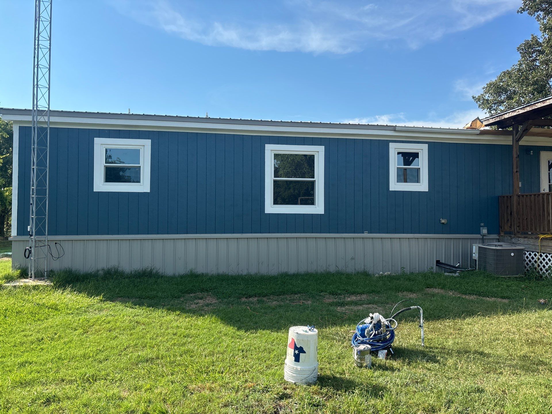 Exterior Painting in Fruitvale, TX | Wood Porch & Home in Deep Navy Blue by Quality Coats Painting