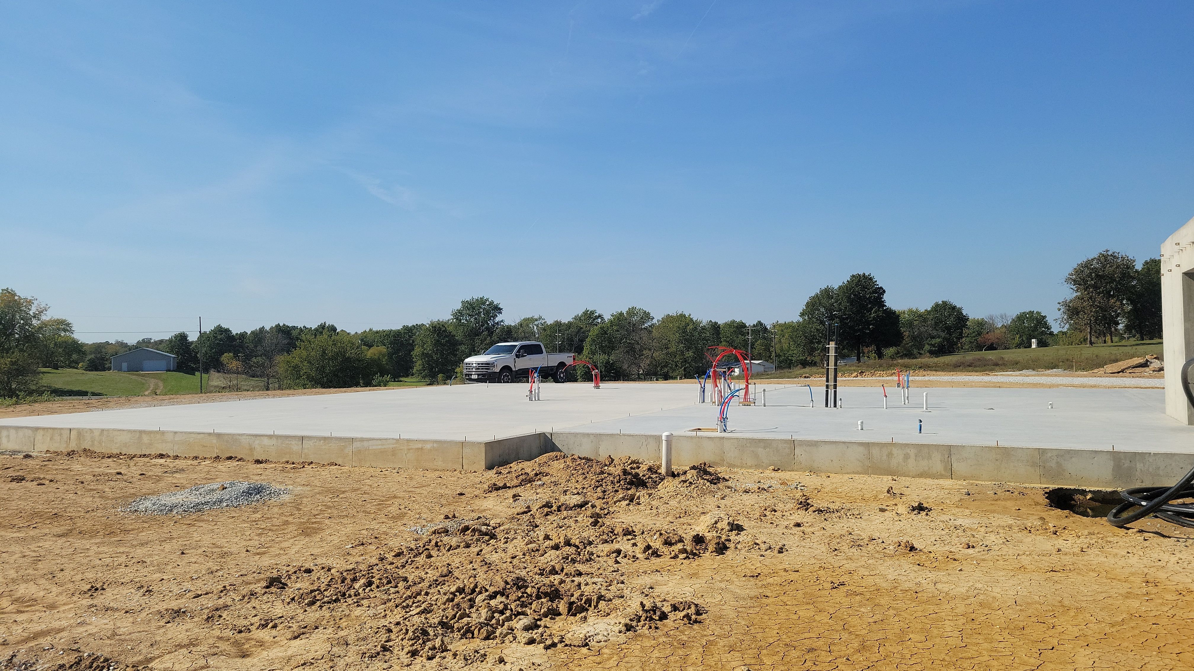 New Home construction w/ board and batten sides and metal roof  by Miles Construction 