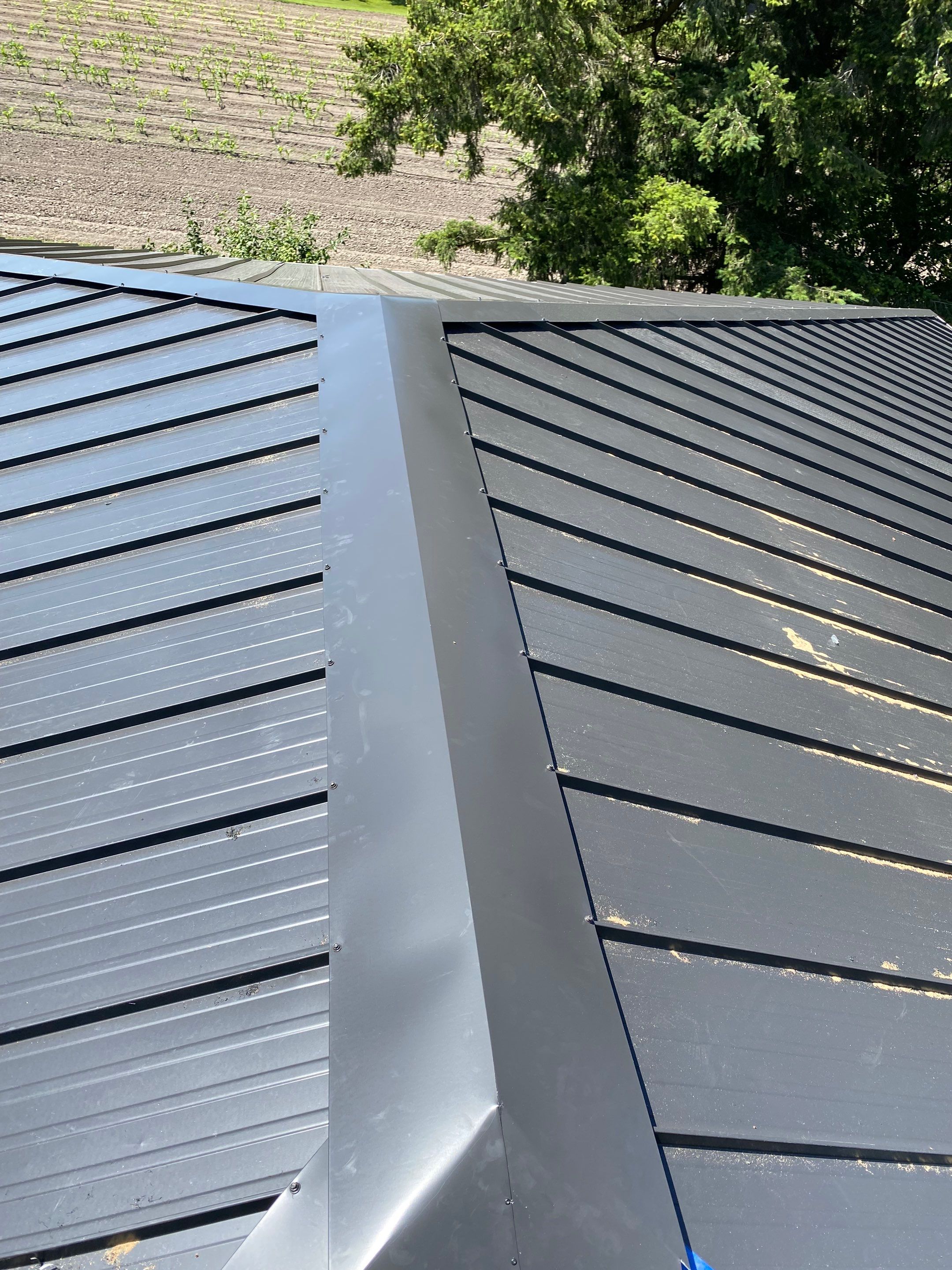 Residential Roofing Installation using 12" Prolok metal  by Top Notch Roofing Inc