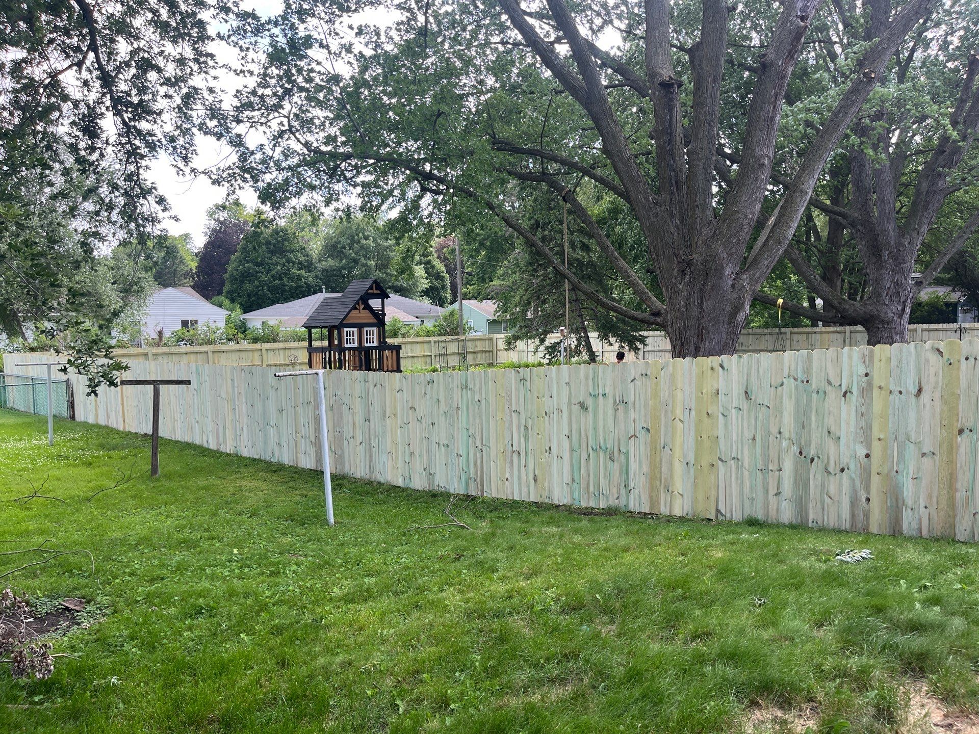 Custom Treated Pine Privacy Fence and Chain Link Installation in Cedar Falls by Perfect Picket Fence and Stain