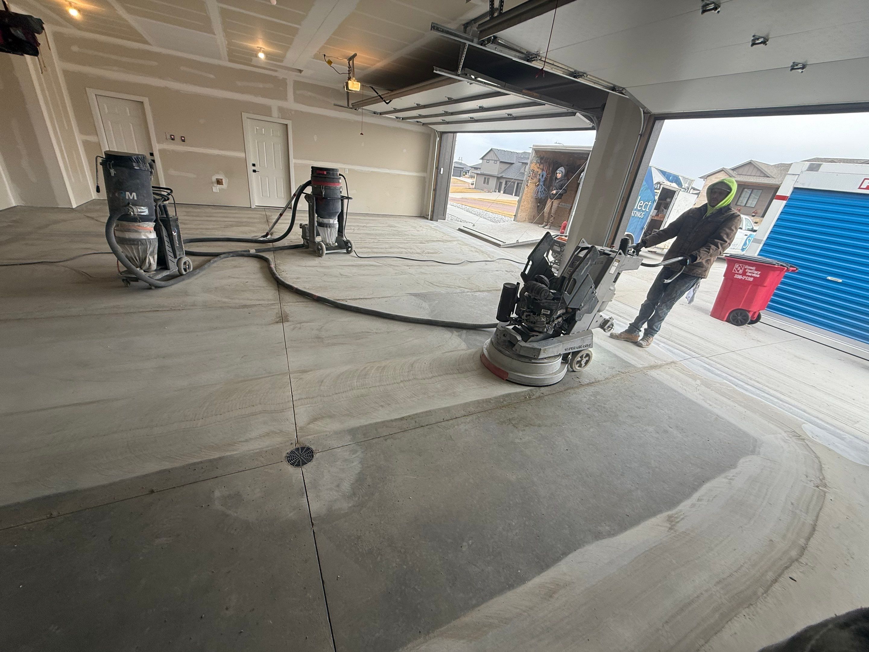 Grey Speckled Epoxy Floor Coating for Sioux Falls Garage by Select Painting, Coatings & Garage Cabinets