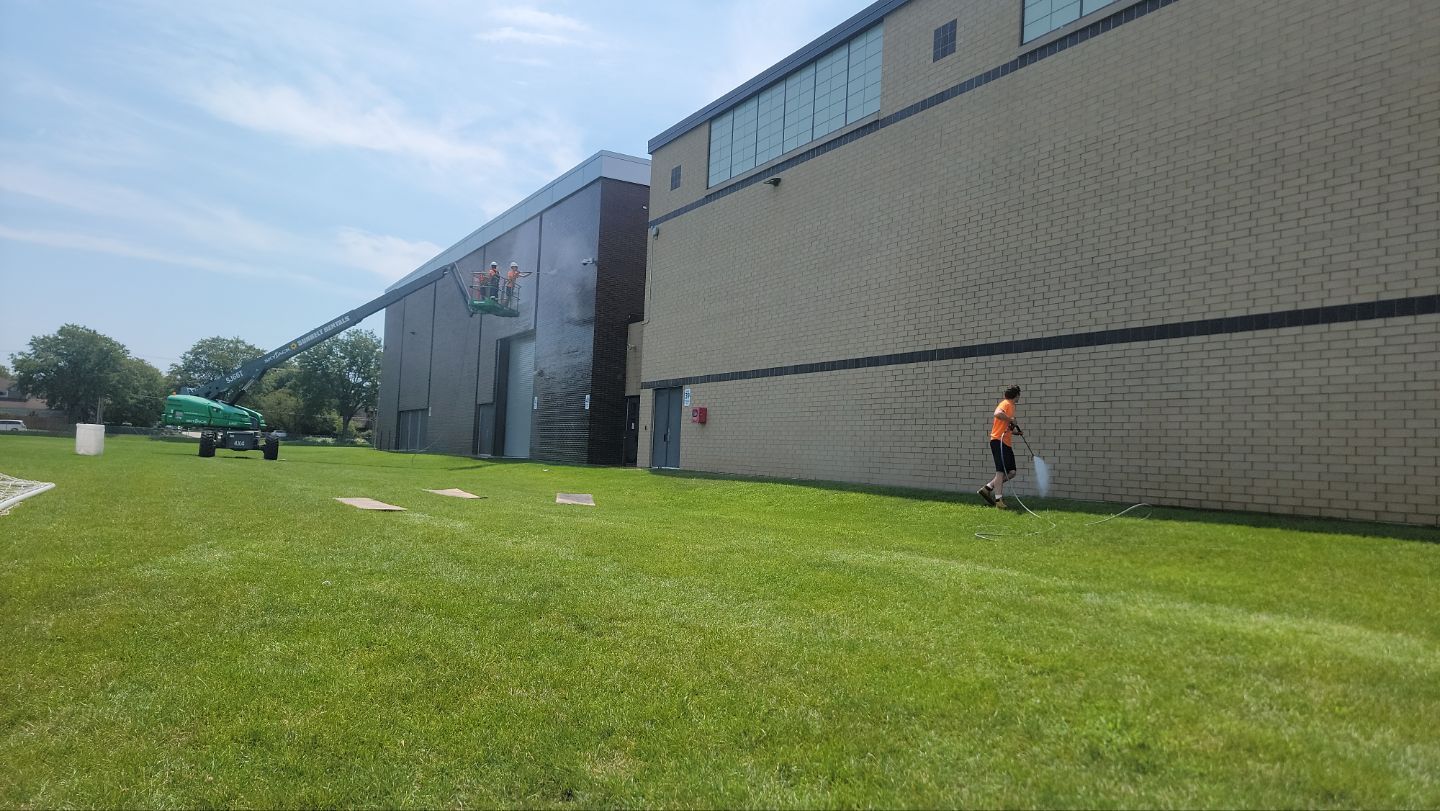 commercial pressure washing using Algaecide, soft wash soap by Northern Power Washing LLC.