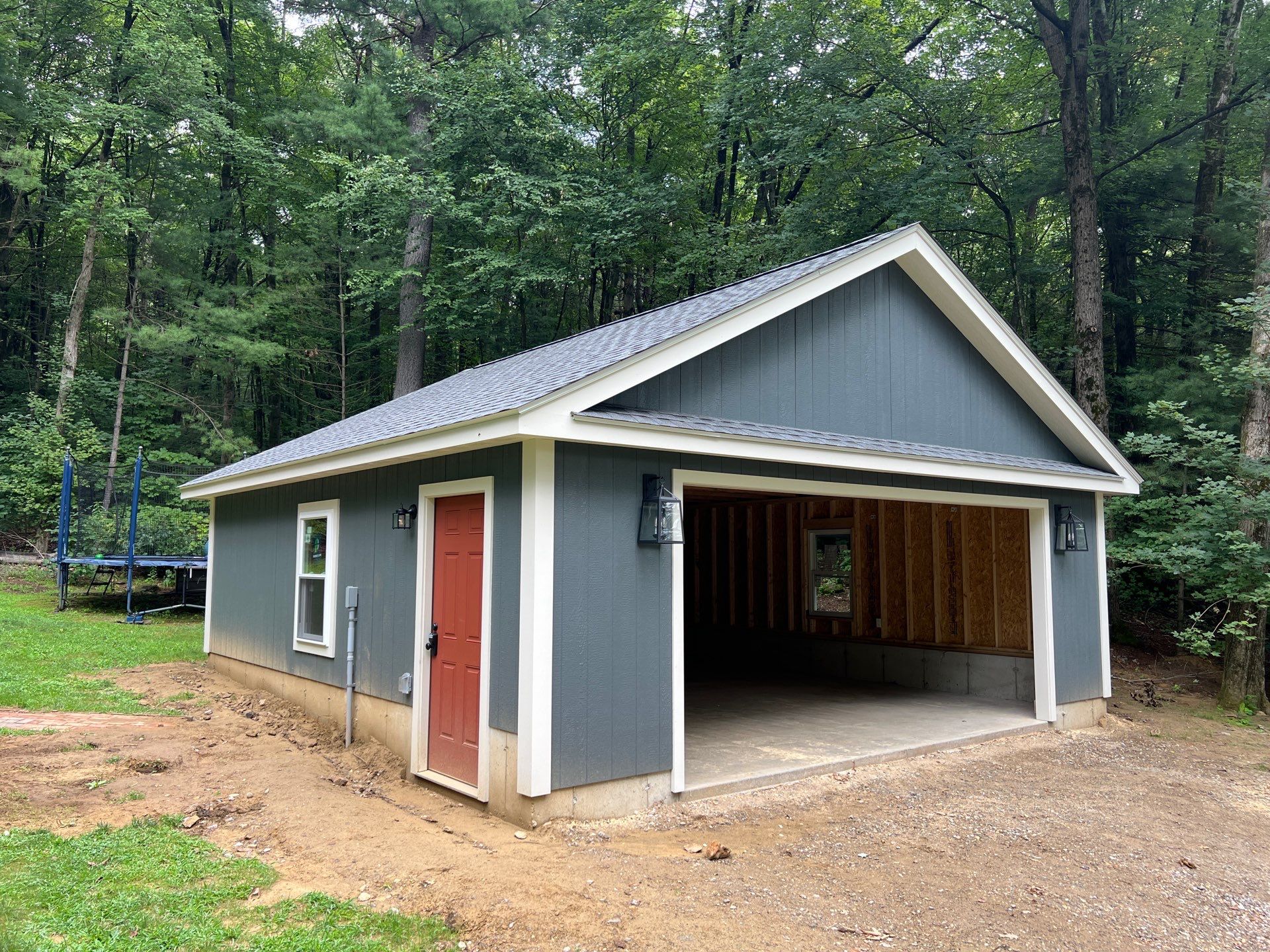 Garage using LP SmartSide Panel Siding by Chagnon Building & Remodeling LLC