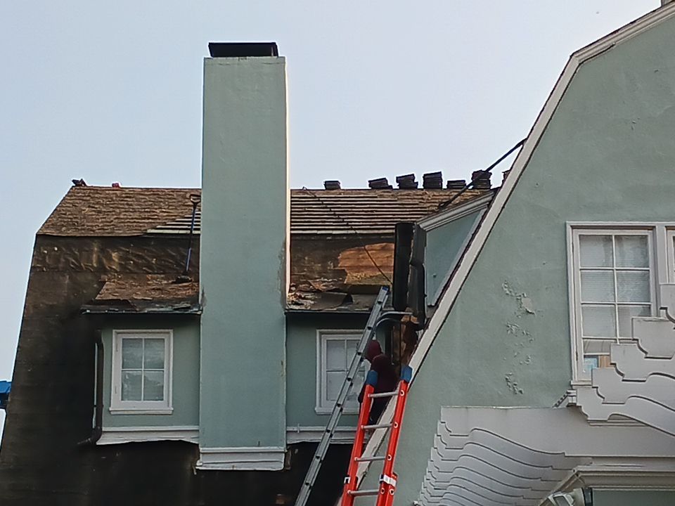 Slate removal/Cedar Shake replacement by Storm Contracting 