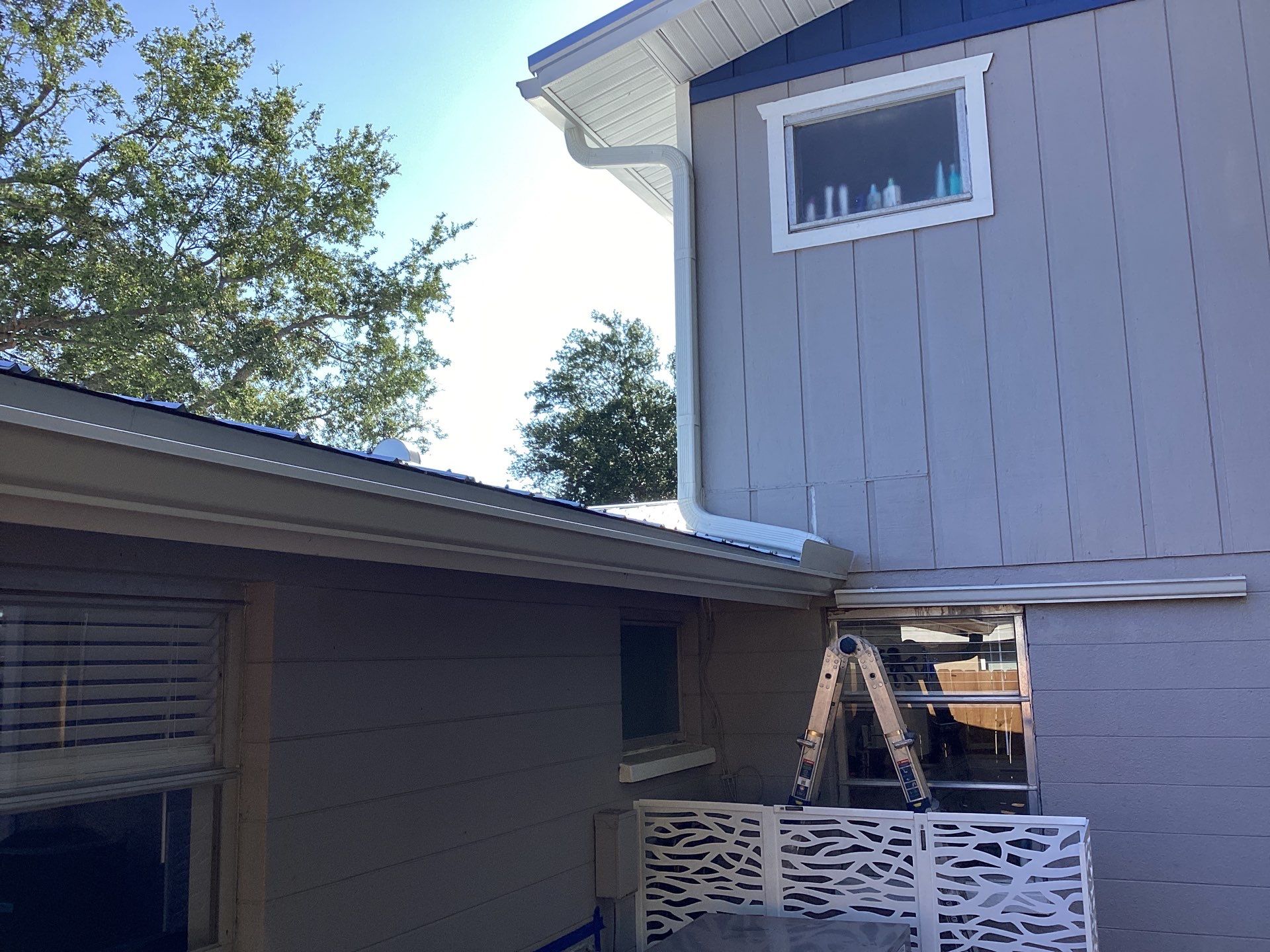 White K Style Seamless Gutters using 3X4 Elbow Downspout in Sarasota FL by Gutter Professors
