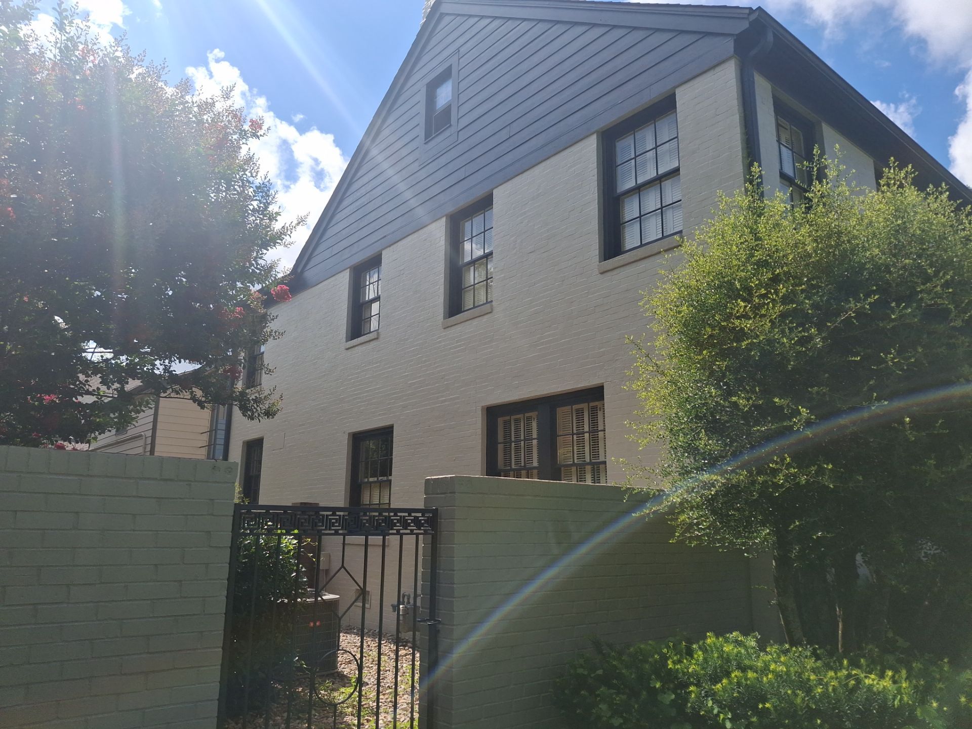Exterior Painting in Tyler, TX | White Brick Home with Sherwin-Williams Duration by Quality Coats Painting