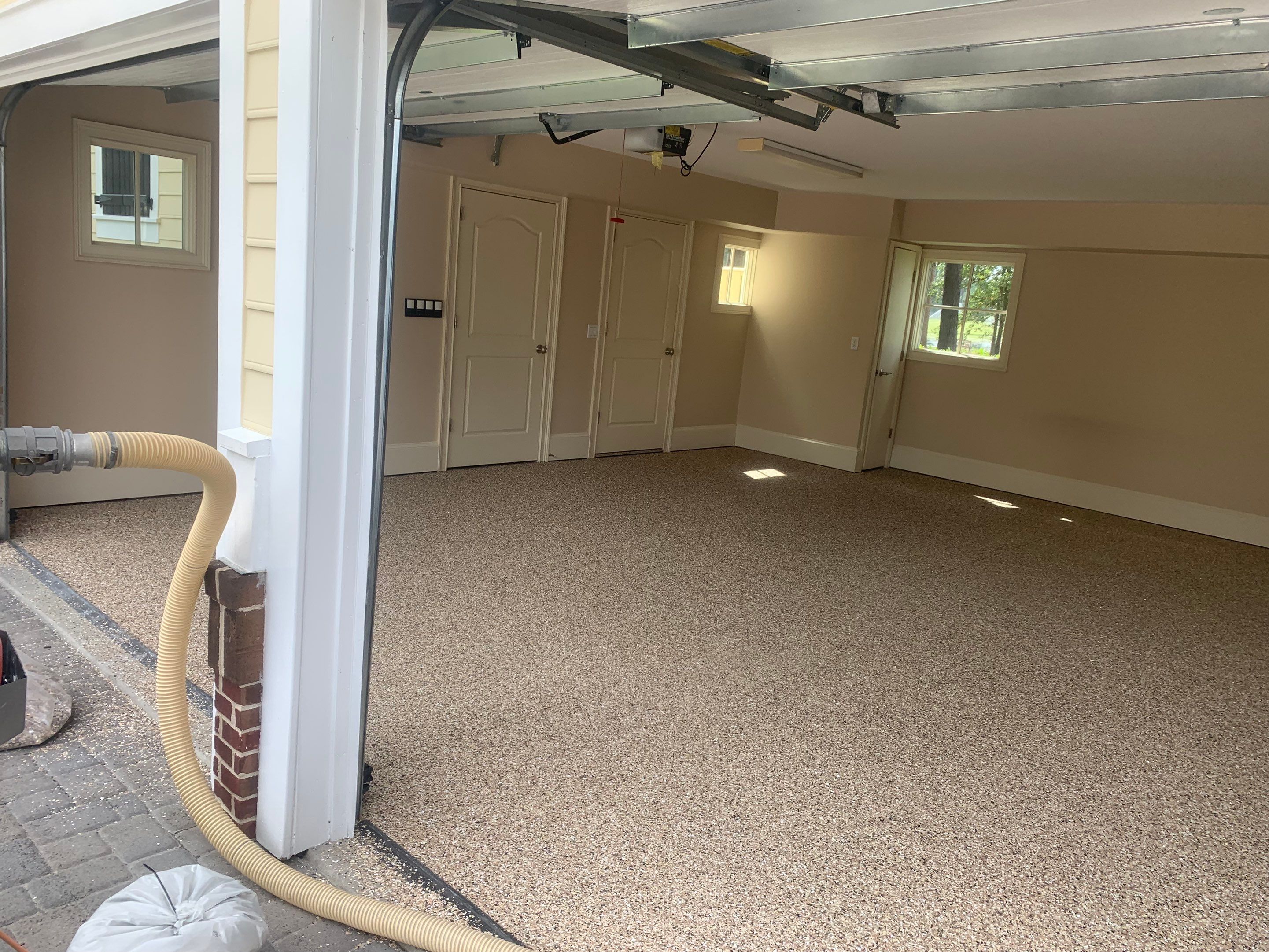 Garage TransFLOORmation using Sandstone by Innovative Concrete Coatings 