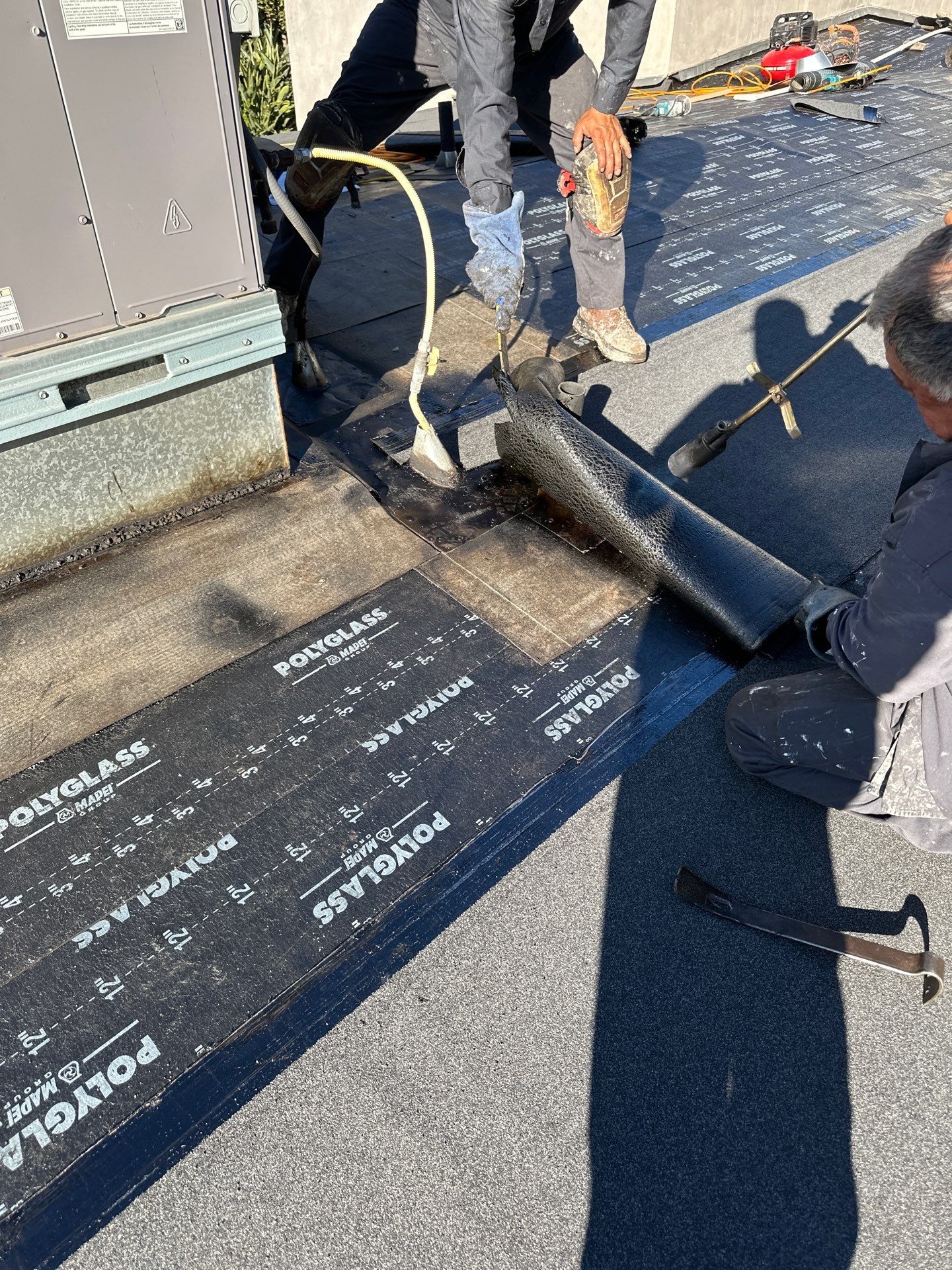 Residential Roofing Installation using Polyfresko® G Highly Reflective Modified Bitumen Cap Sheet by Hull Brothers Roofing