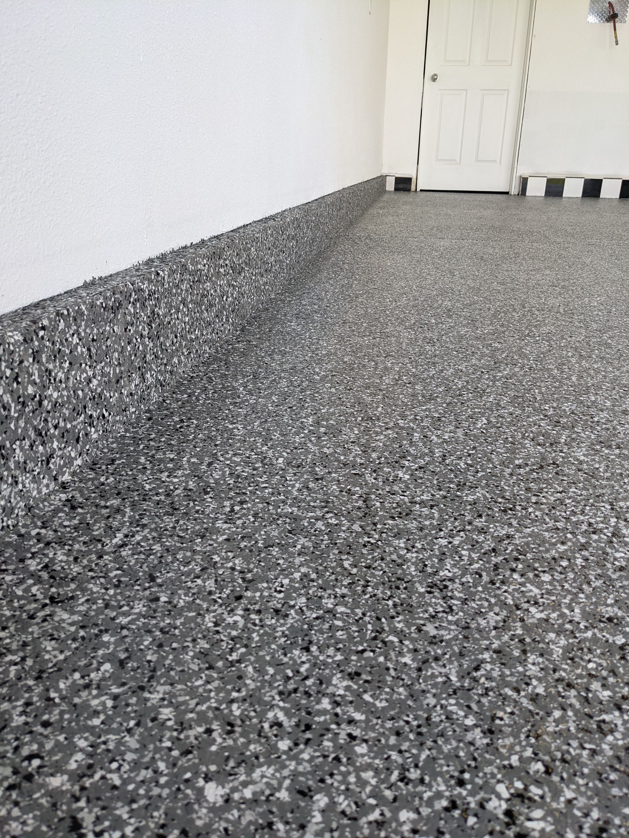 Garage Transformation using Smoke by Croc Coatings, LLC