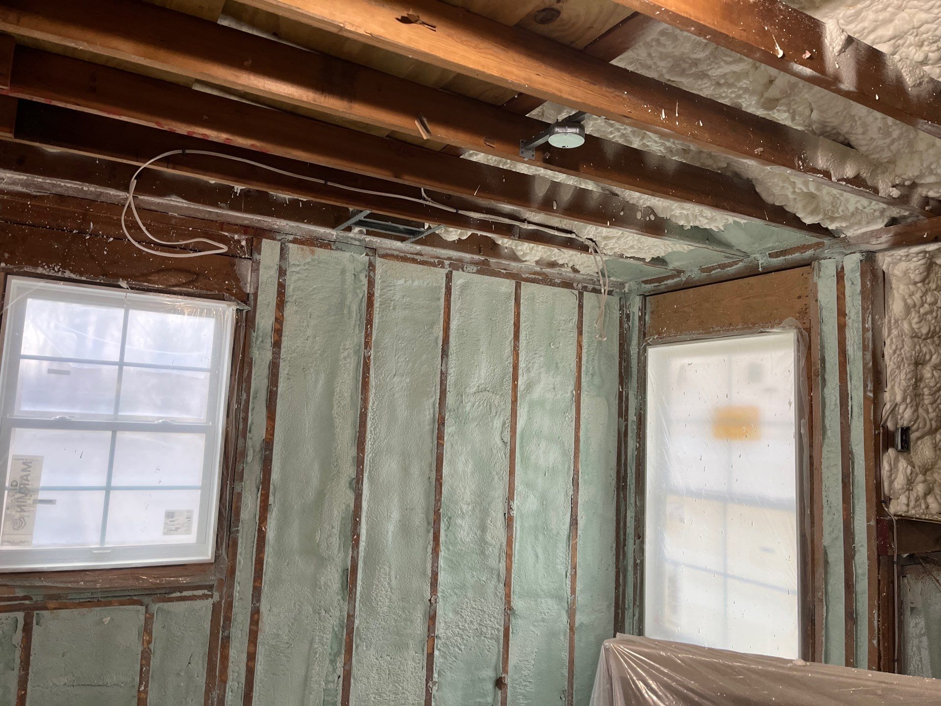 Basement Exterior Walls using Closed Cell Spray Foam by NYS Foam & Energy