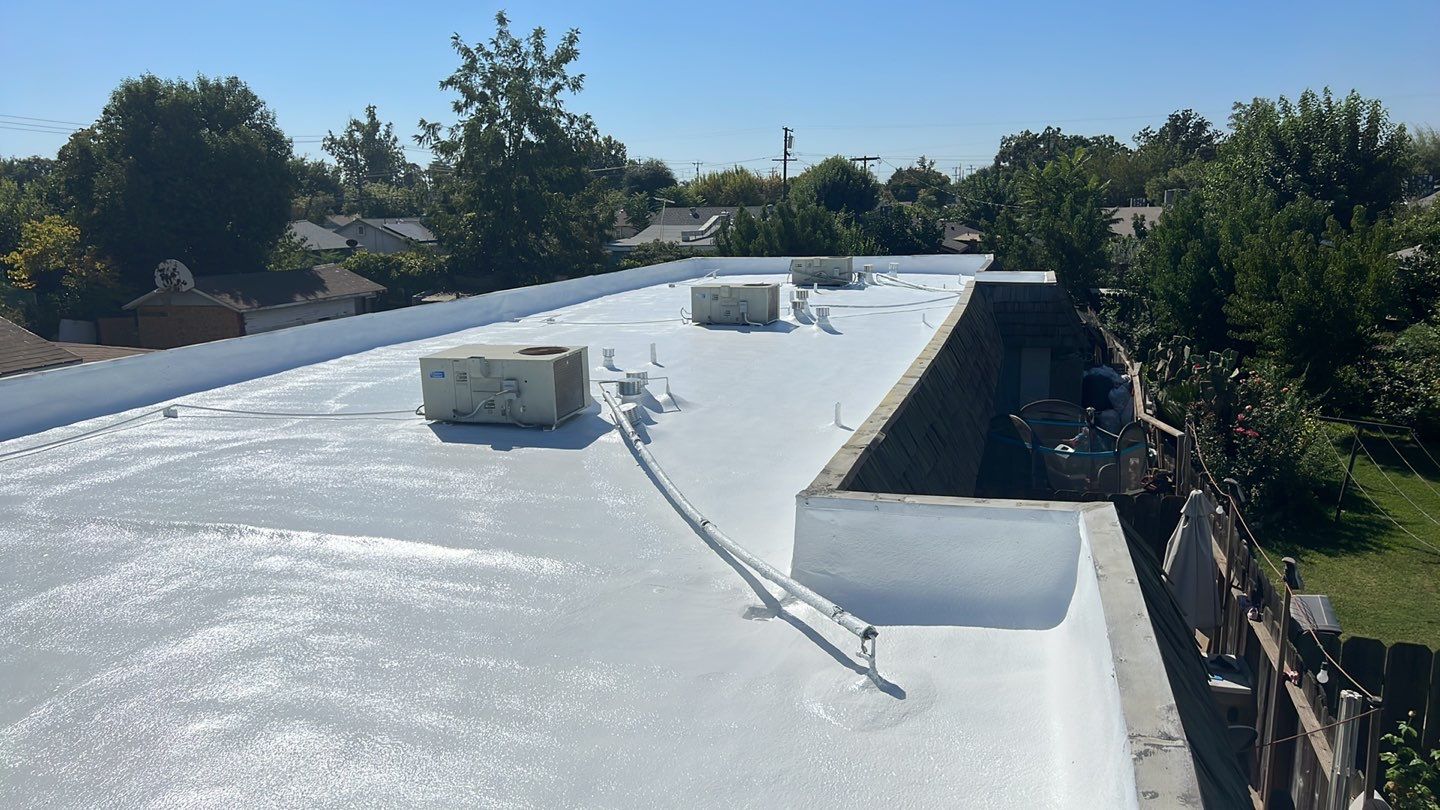 Foam Refurbish using Conklin Benchmark/PUMA XL coatings and spray foam; Also metal roofing around parapet wall by Straight Edge Roofing Inc