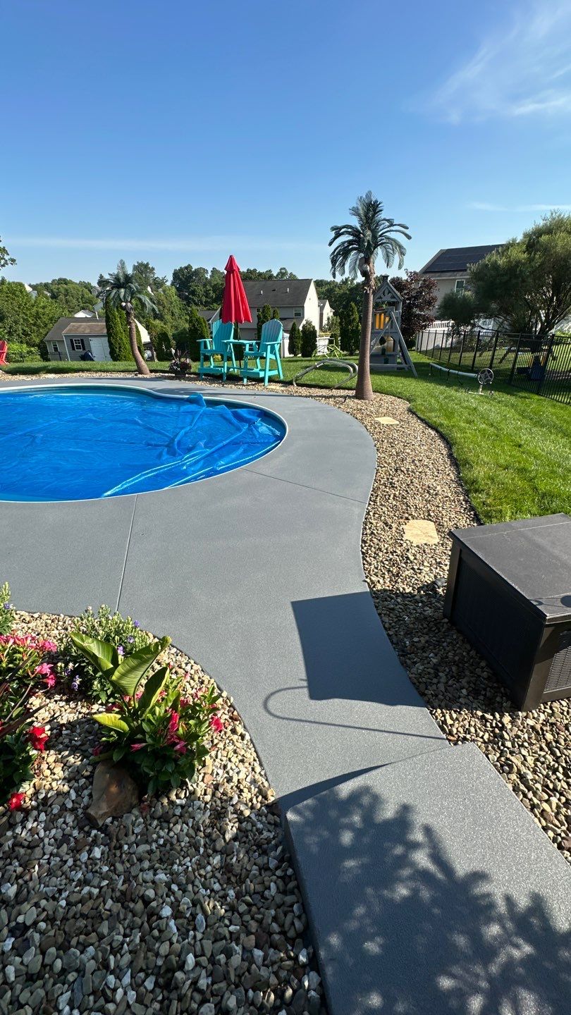 Twilight Pool Deck / Patio Project in Beaver falls by Floors in a Day, Inc