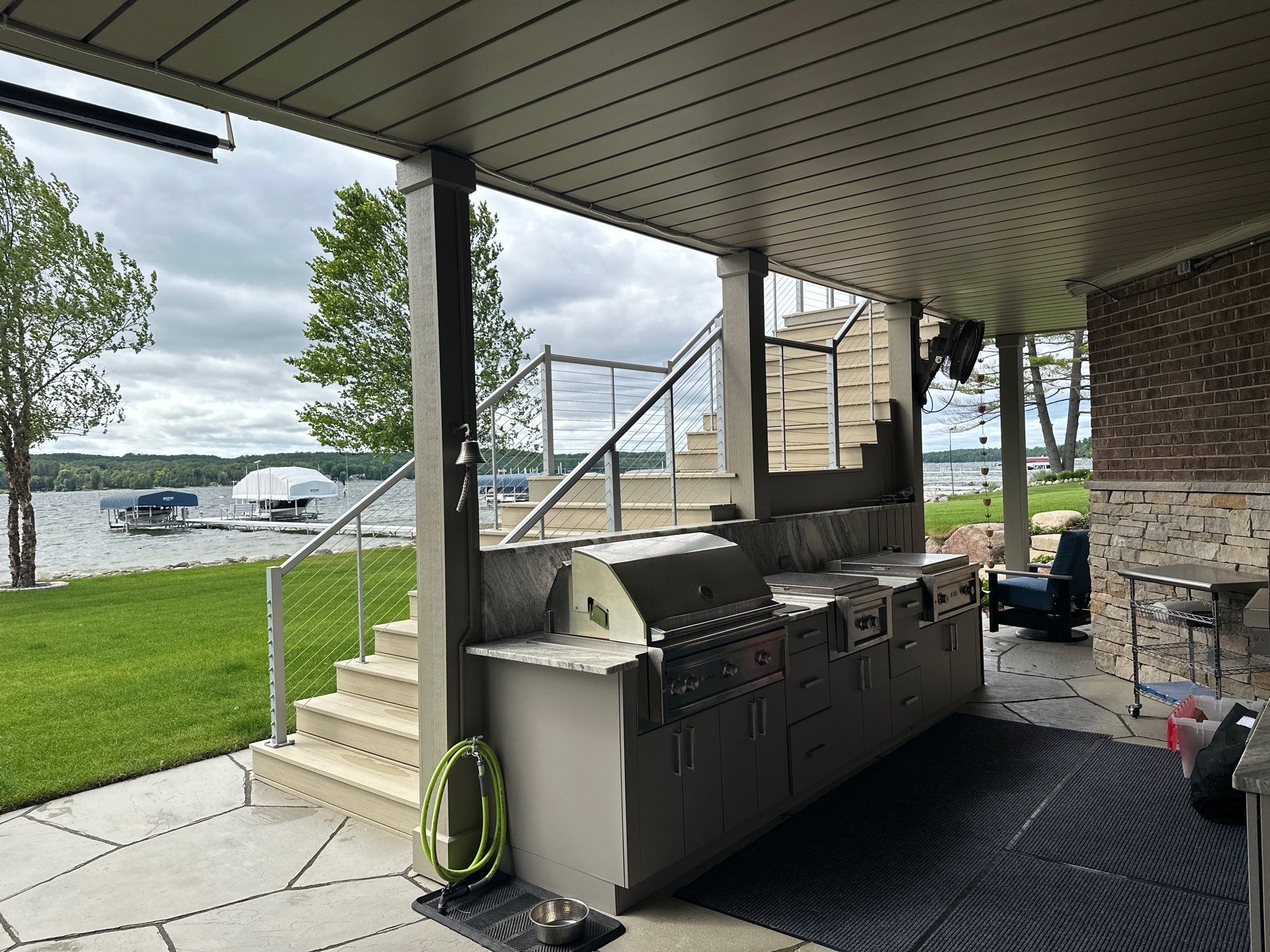 Custom Underdecking System and Outdoor Kitchen in East Jordan by Rainbow Seamless Systems