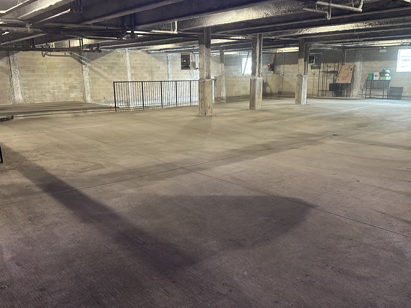 Parking garage using Hot water by Northern Power Washing LLC.