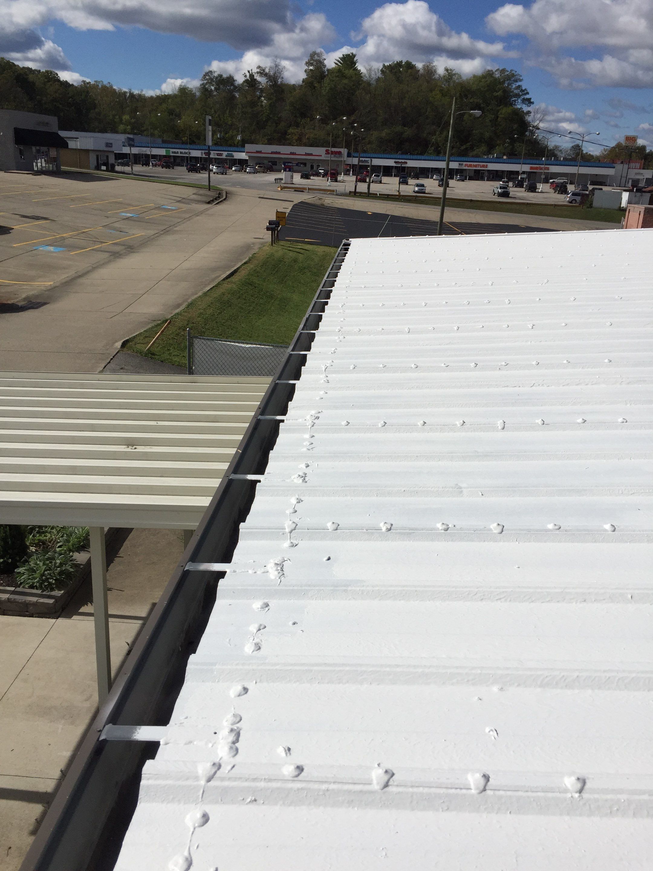Commercial Roof Coating using Gaco Silicone Roof Coating by Secure Construction Company Inc