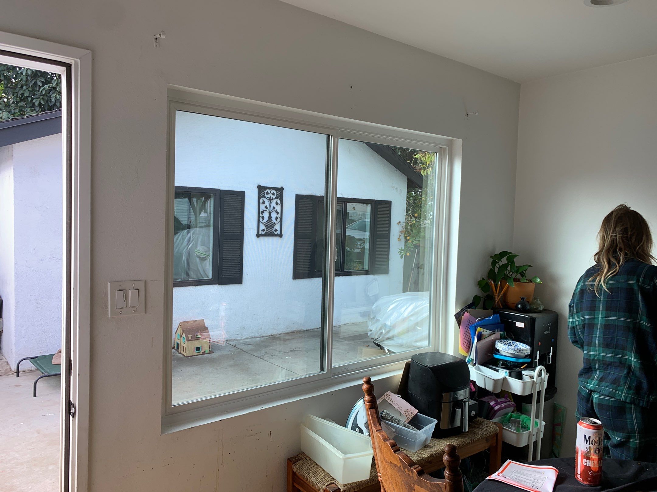 Window Installation using black Vinyl Windows by American Window Company