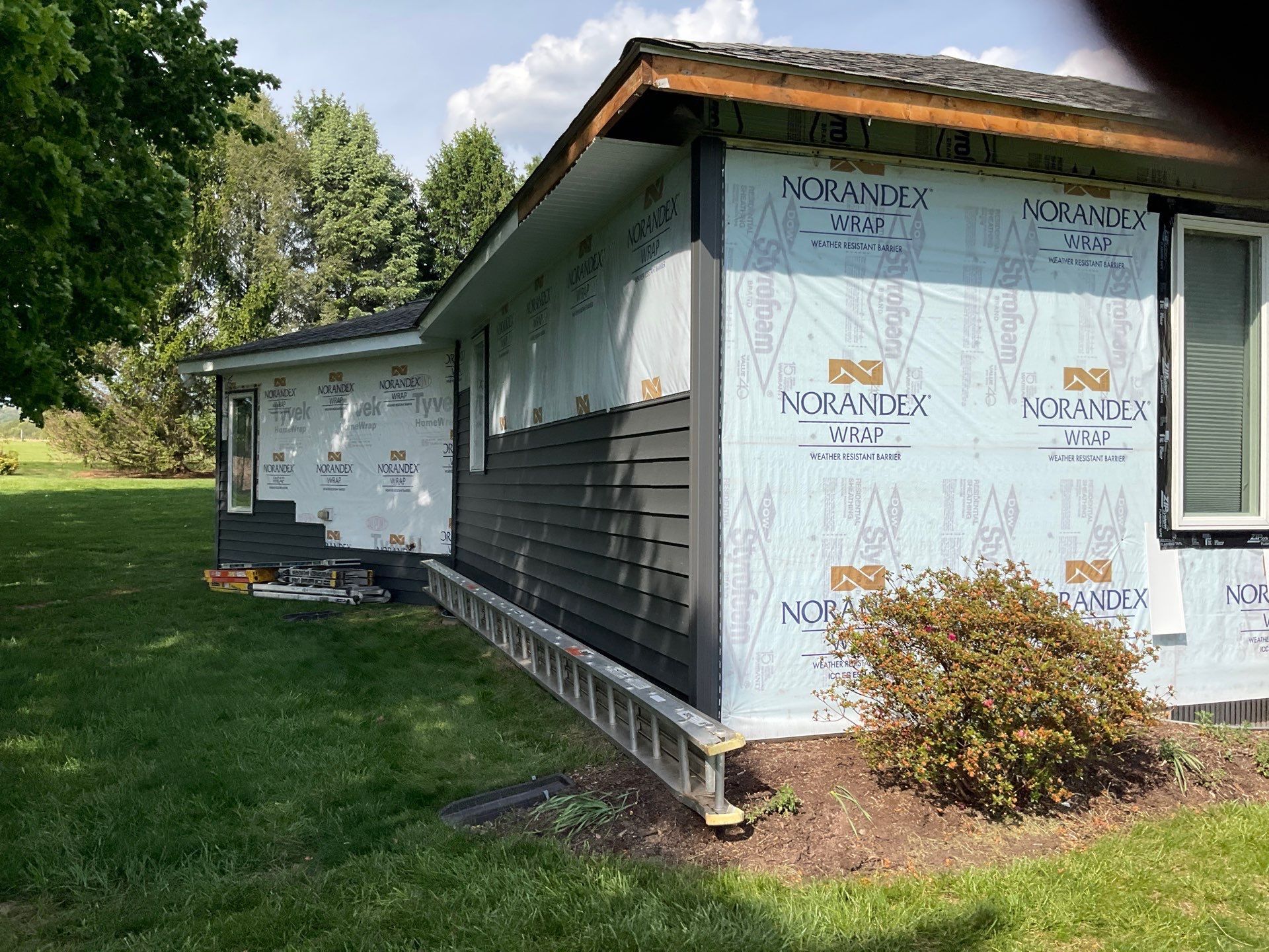 Nightfall Exterior Siding Replacement and Stone Veneer in Halifax by Esh Builders