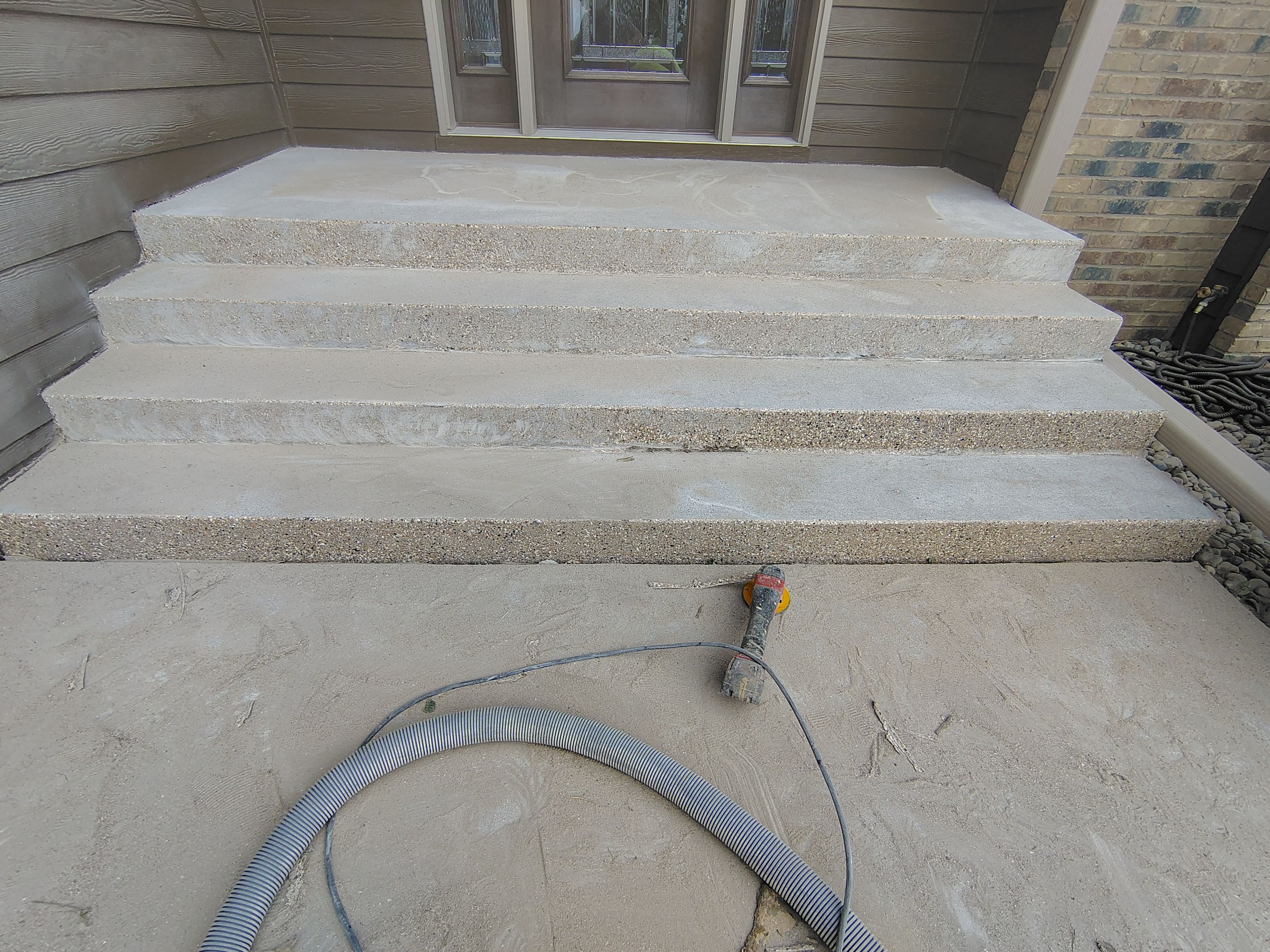 Textured Concrete Coating and Entryway Restoration in Madison by Select Painting, Coatings & Garage Cabinets