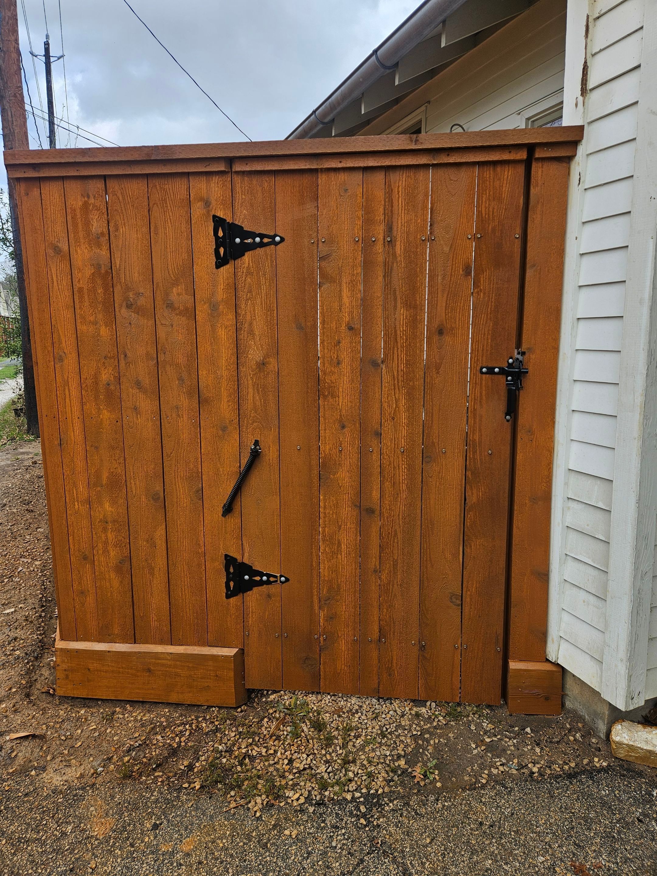 Durable Fence & Gate Installation with Premium Stain by Tim's Fences