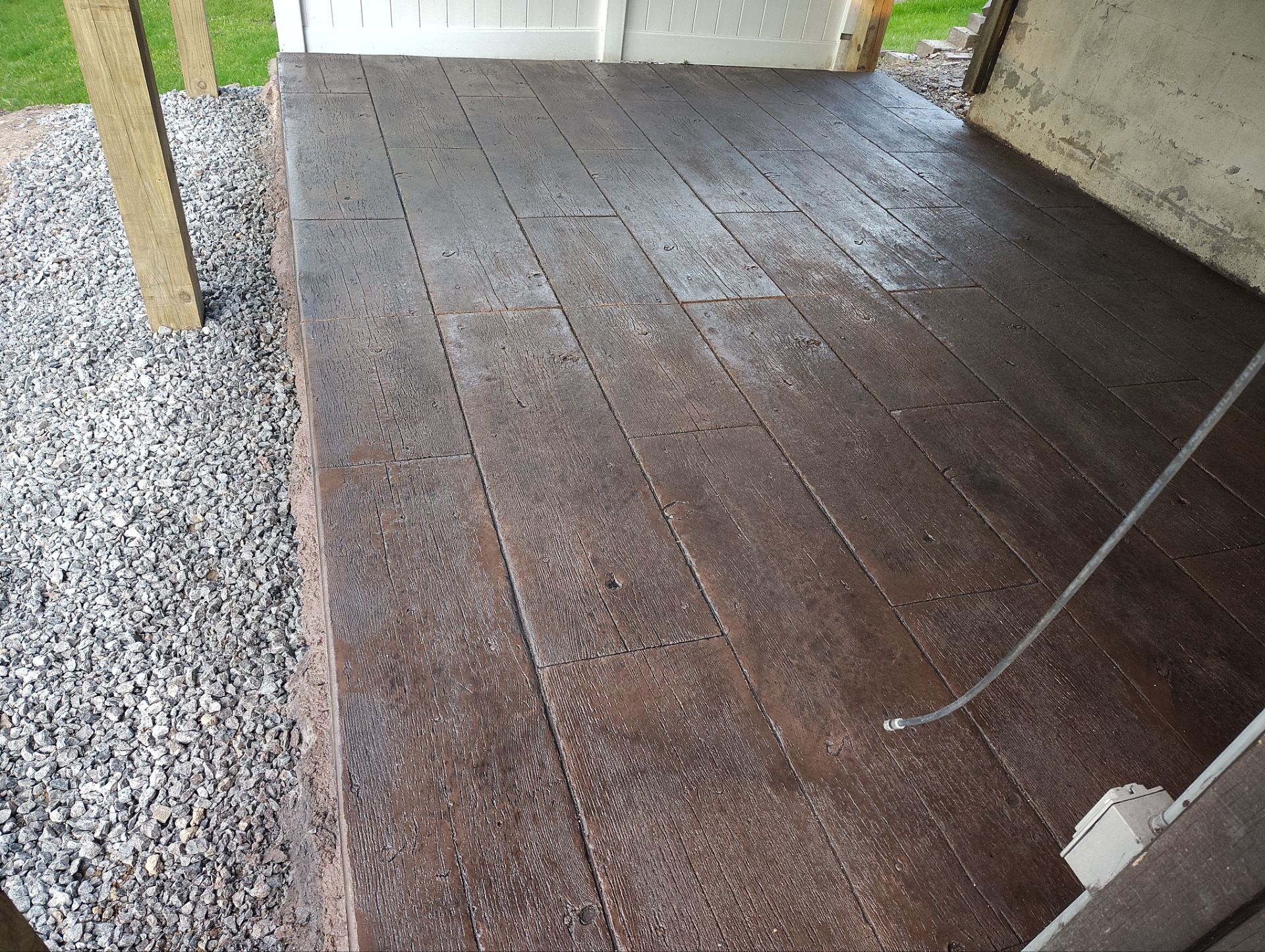 Custom Composite Deck and Wood-Plank Stamped Concrete Patio in Pittsburgh by Cousins Roofing Siding & Decks