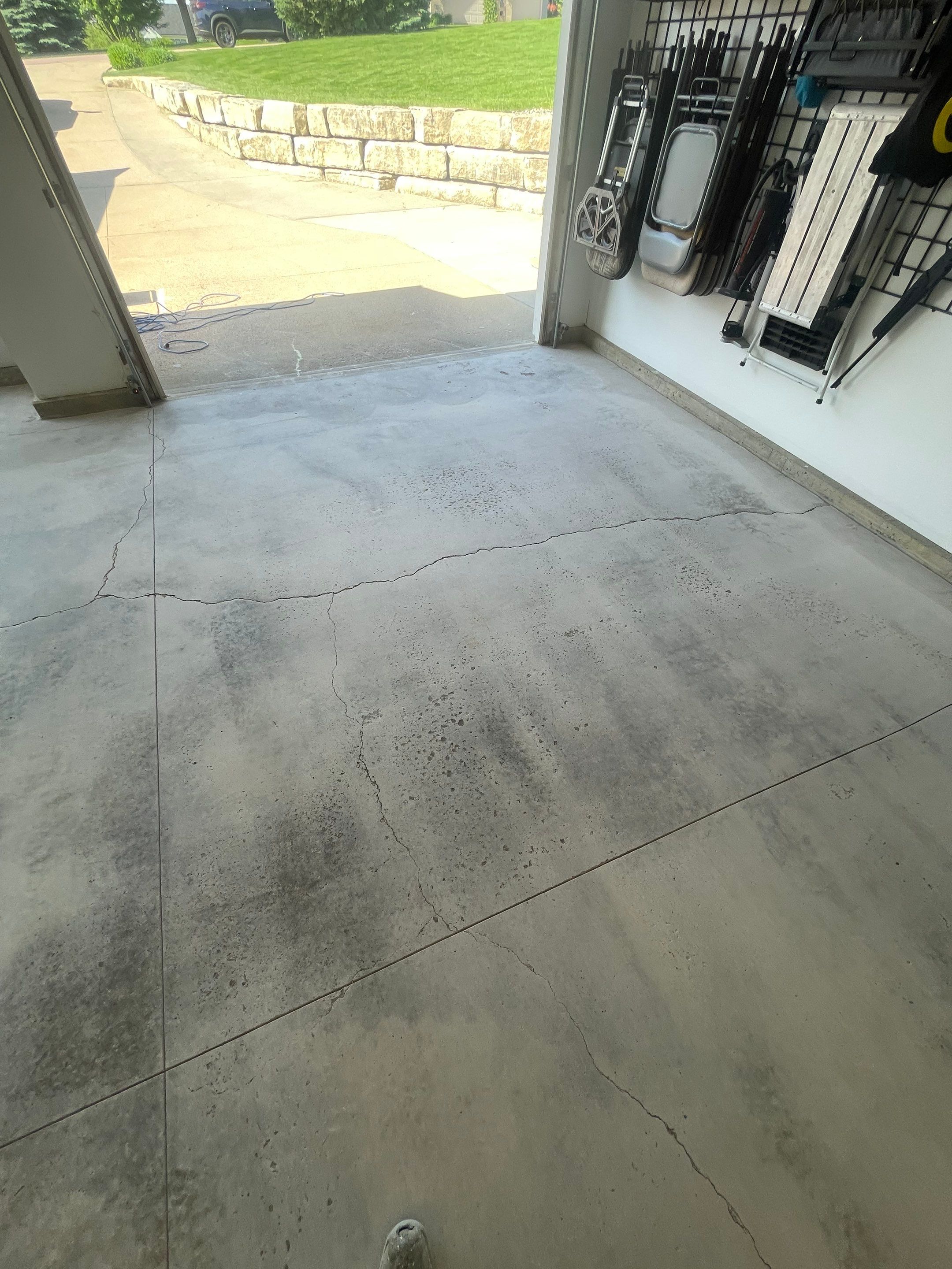 Feather Grey Garage Floor Coating Installation in Sioux Falls by Select Painting, Coatings & Garage Cabinets