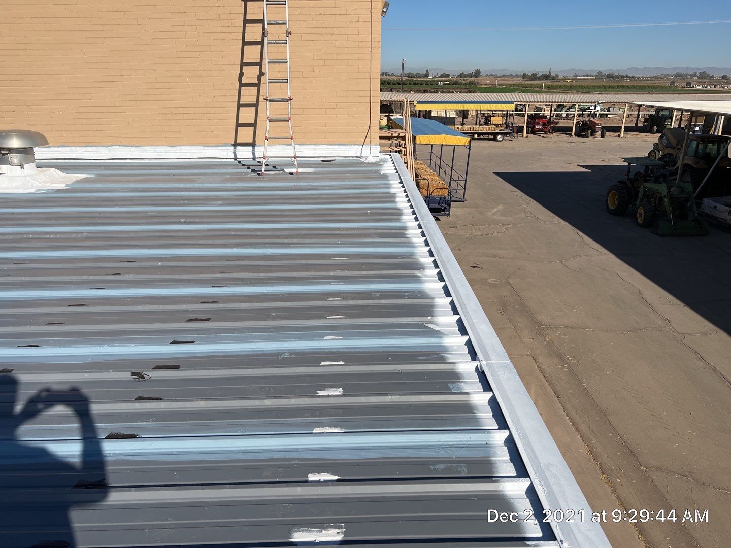 Metal roof restoration on commercial roof using Conklin Benchmark/PUMA XL fabric and coating by Straight Edge Roofing Inc