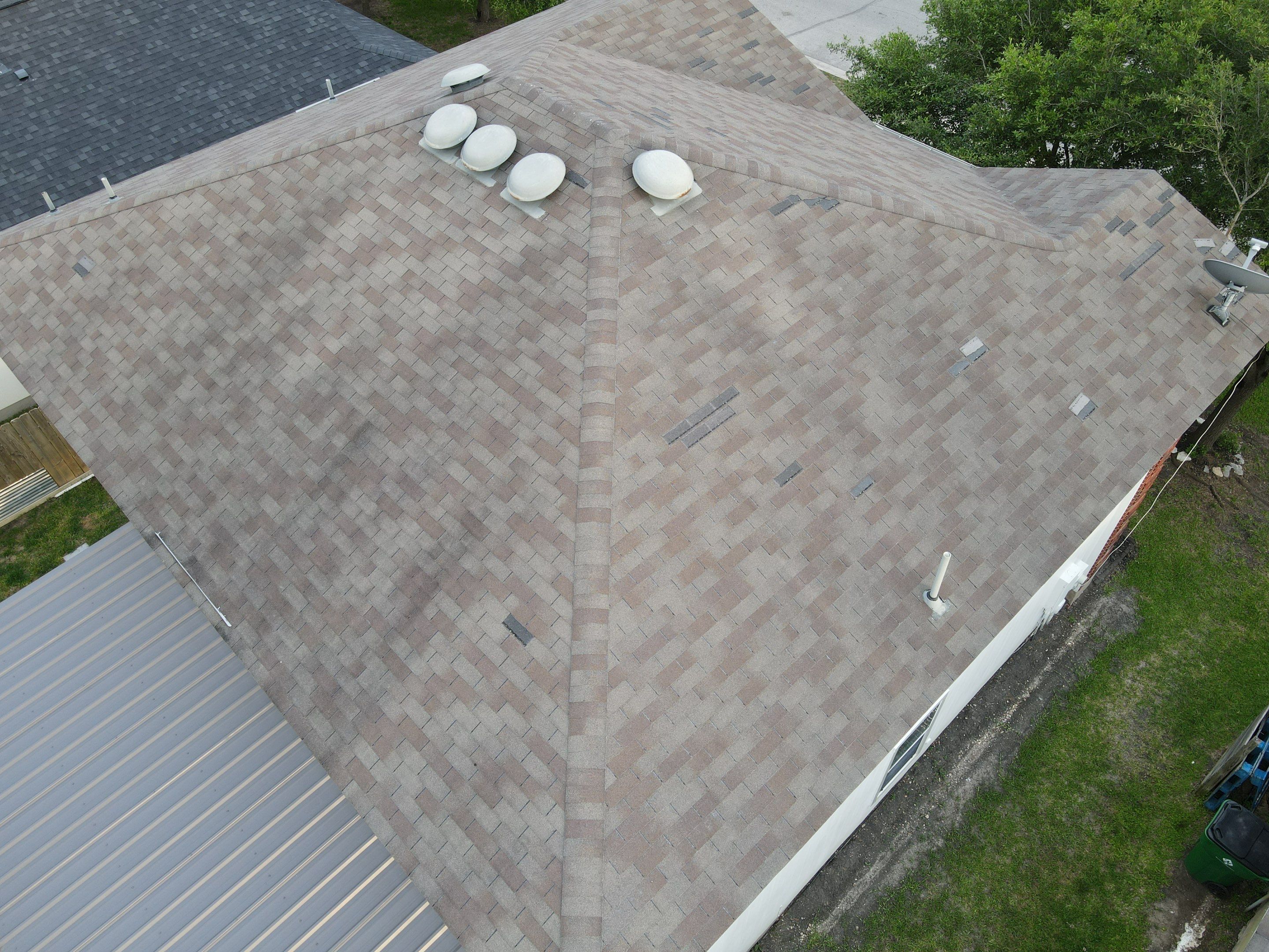 Residential Roofing Replacement and Gutter Installation in Manor by Caliber Restoration LLC