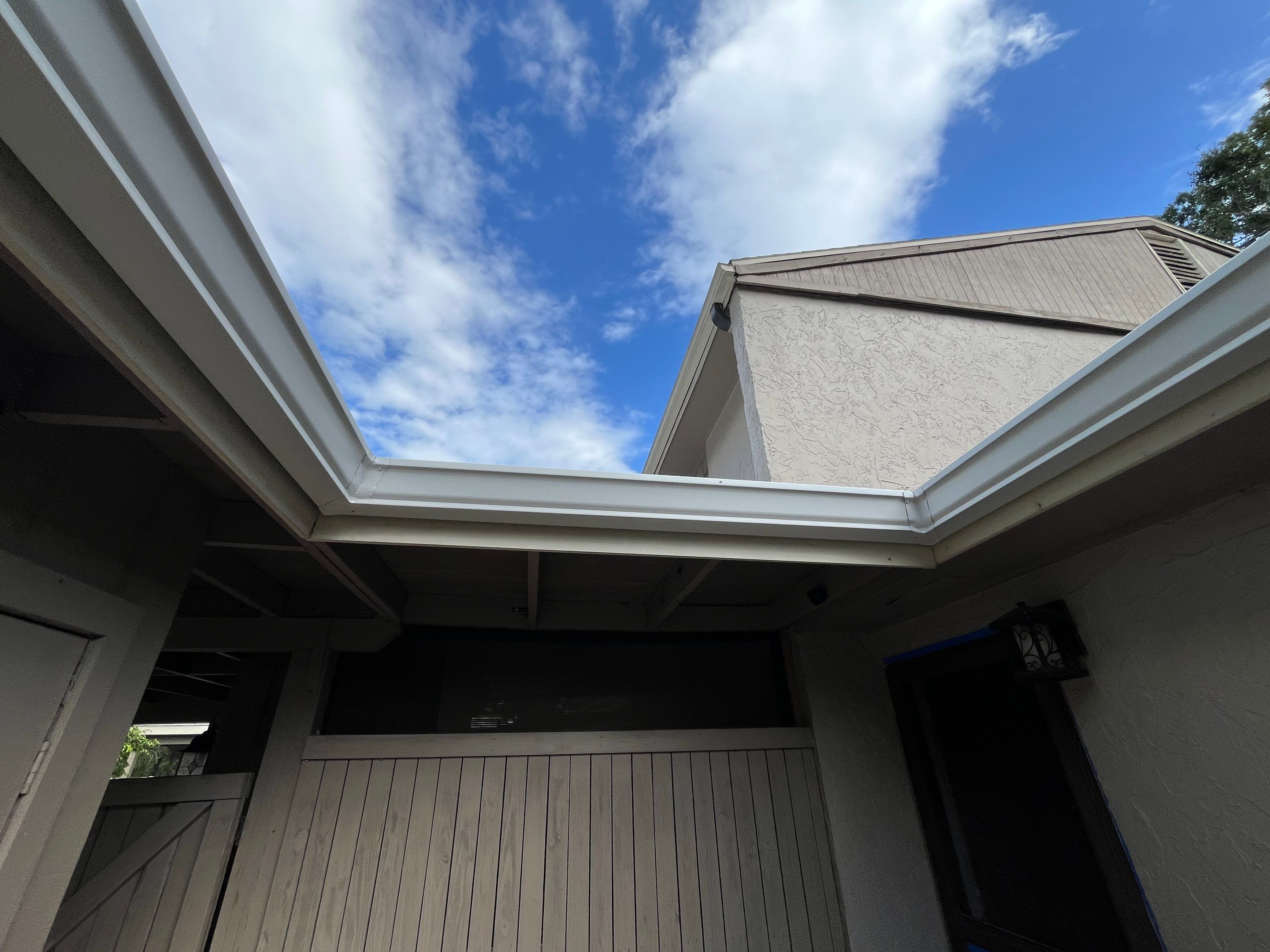 Professional Downspout Installation in Tampa, FL by Gutter Professor by Gutter Professors