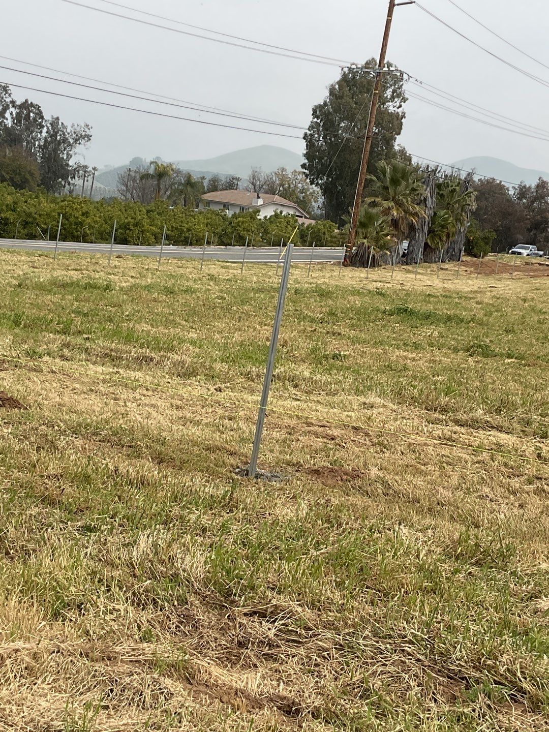 Fence installation using chain link wire by Fence Guys Inc. 