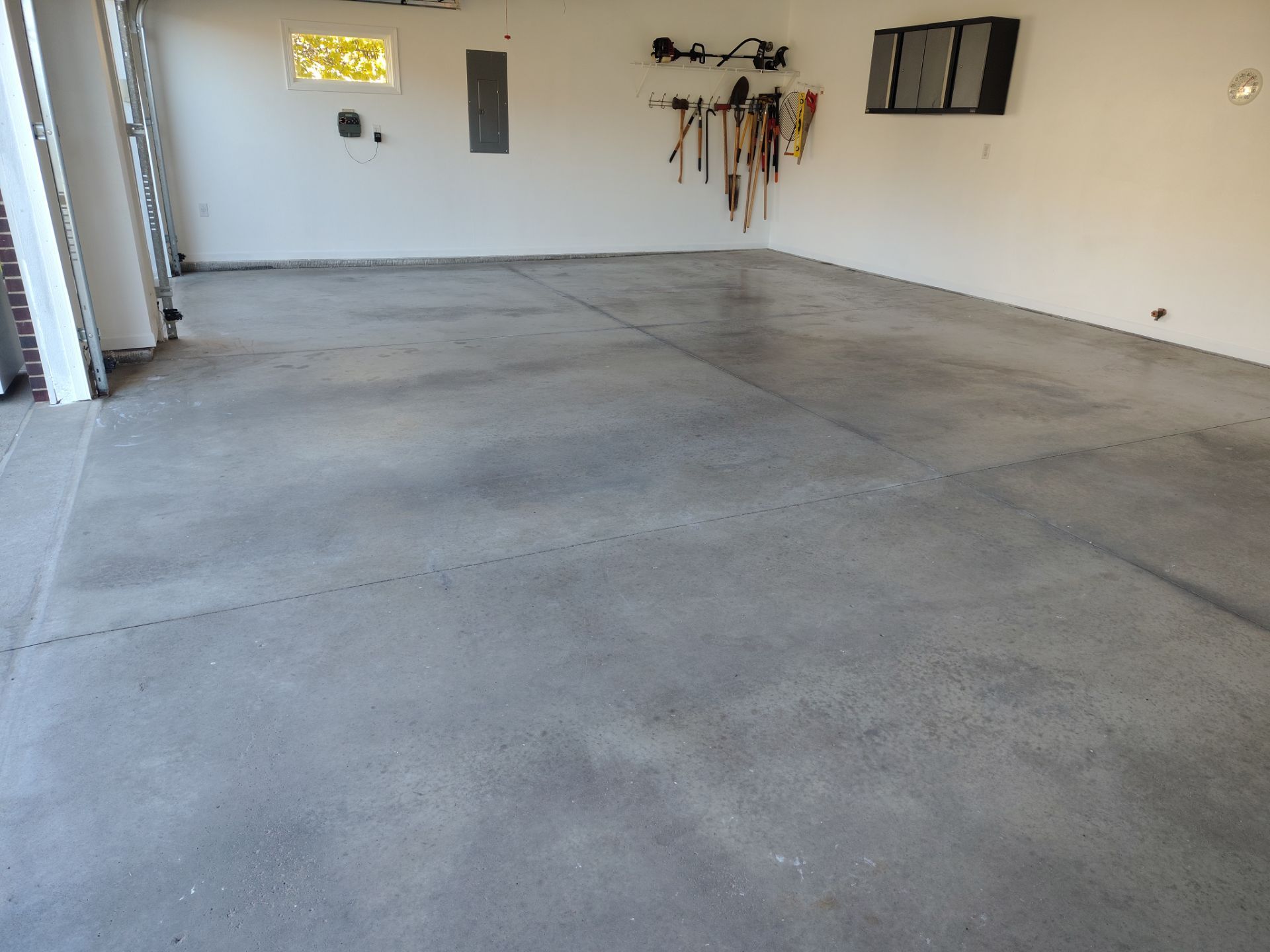 New Johnston Garage Resurfacing by Revival Concrete Coatings, LLC