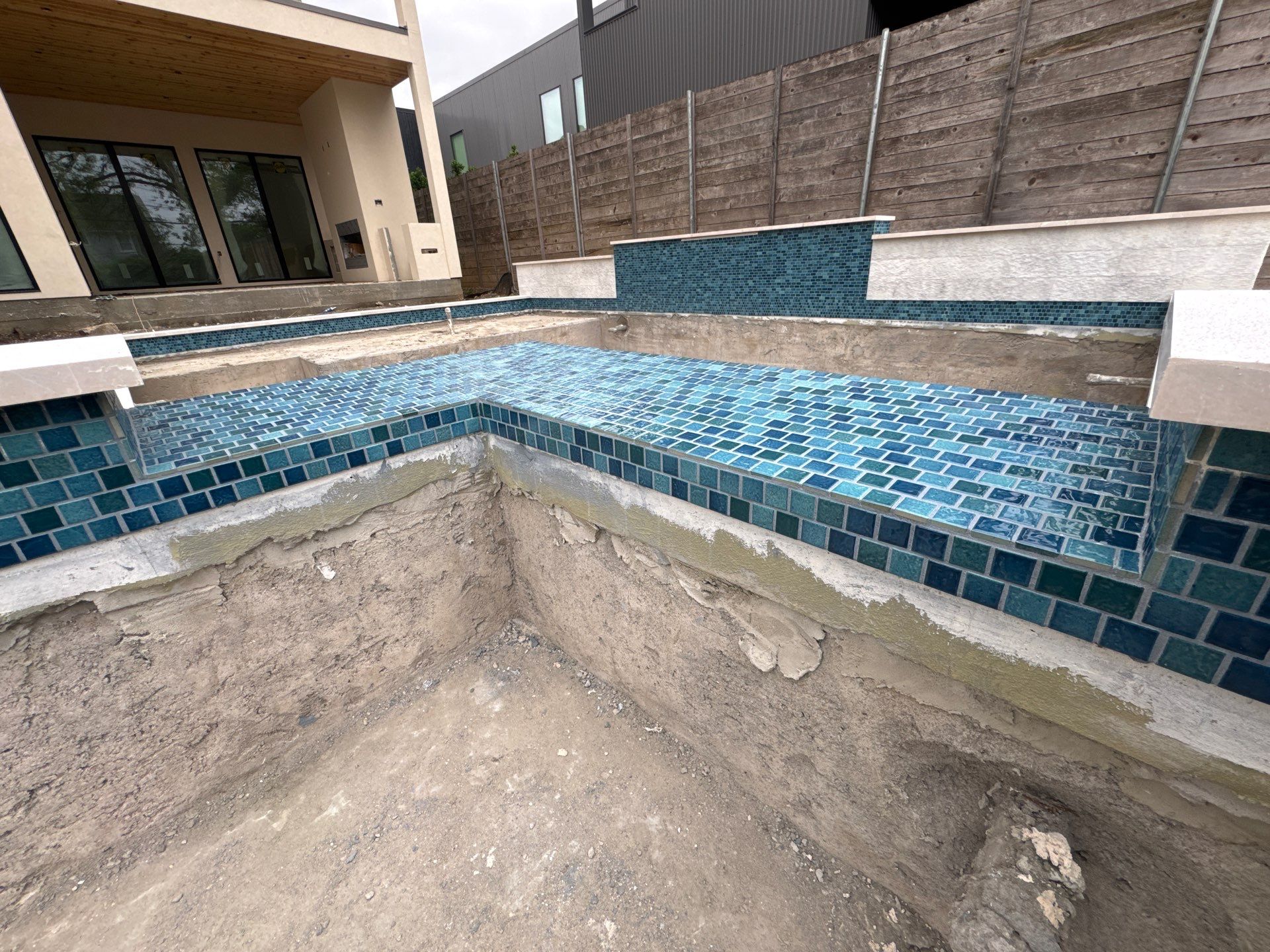 Modern Pool with Raised Glass-Tile Spa by Pinnacle Pools and Spas - DFW
