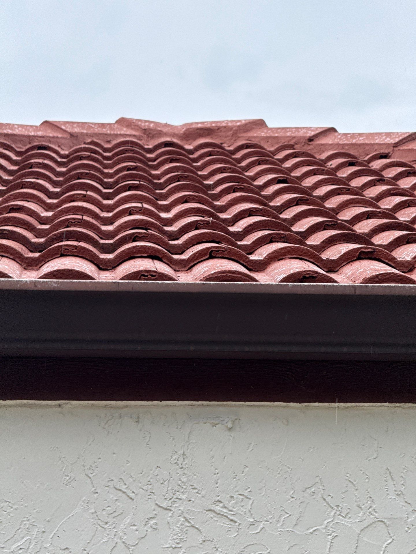 Residential Tile Roof Replacement and Gutter Installation in Winter Park by Pinnacle Roofing Group