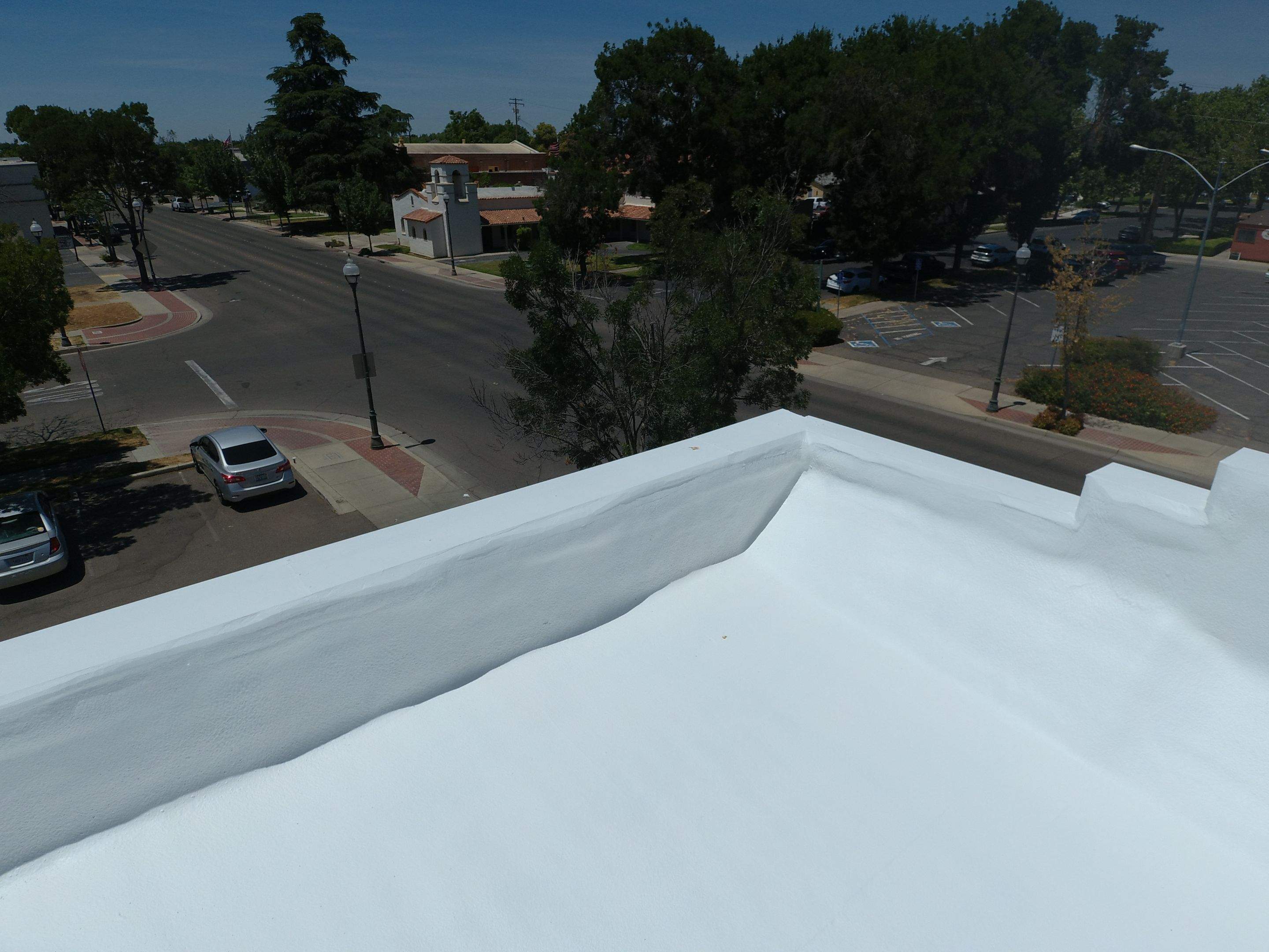 Spray foam and coatings using Conklin Benchmark/PUMA XL coatings and spray foam by Straight Edge Roofing Inc