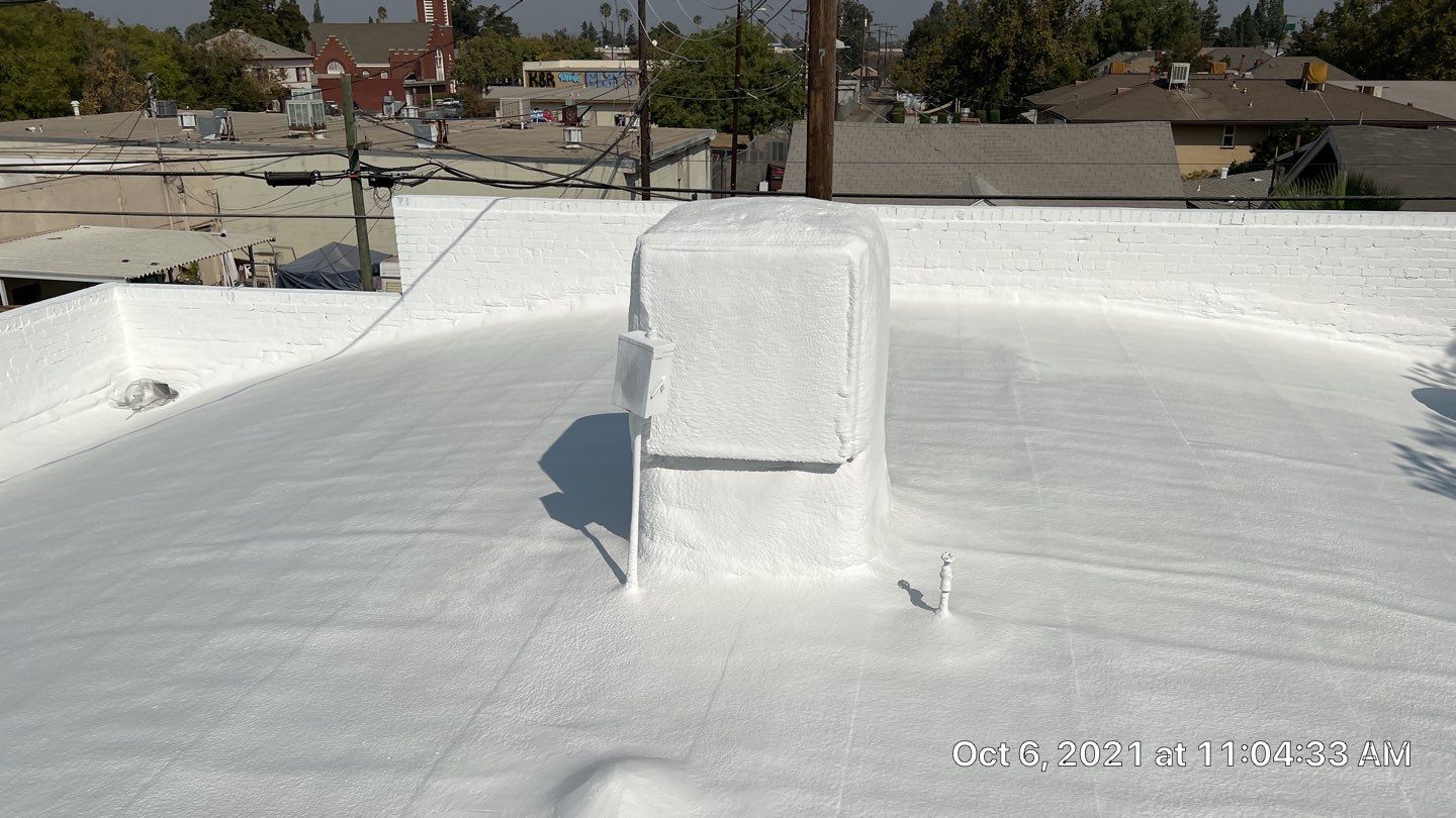 Polyurethane foam roof refurbish and recoating by Straight Edge Roofing Inc